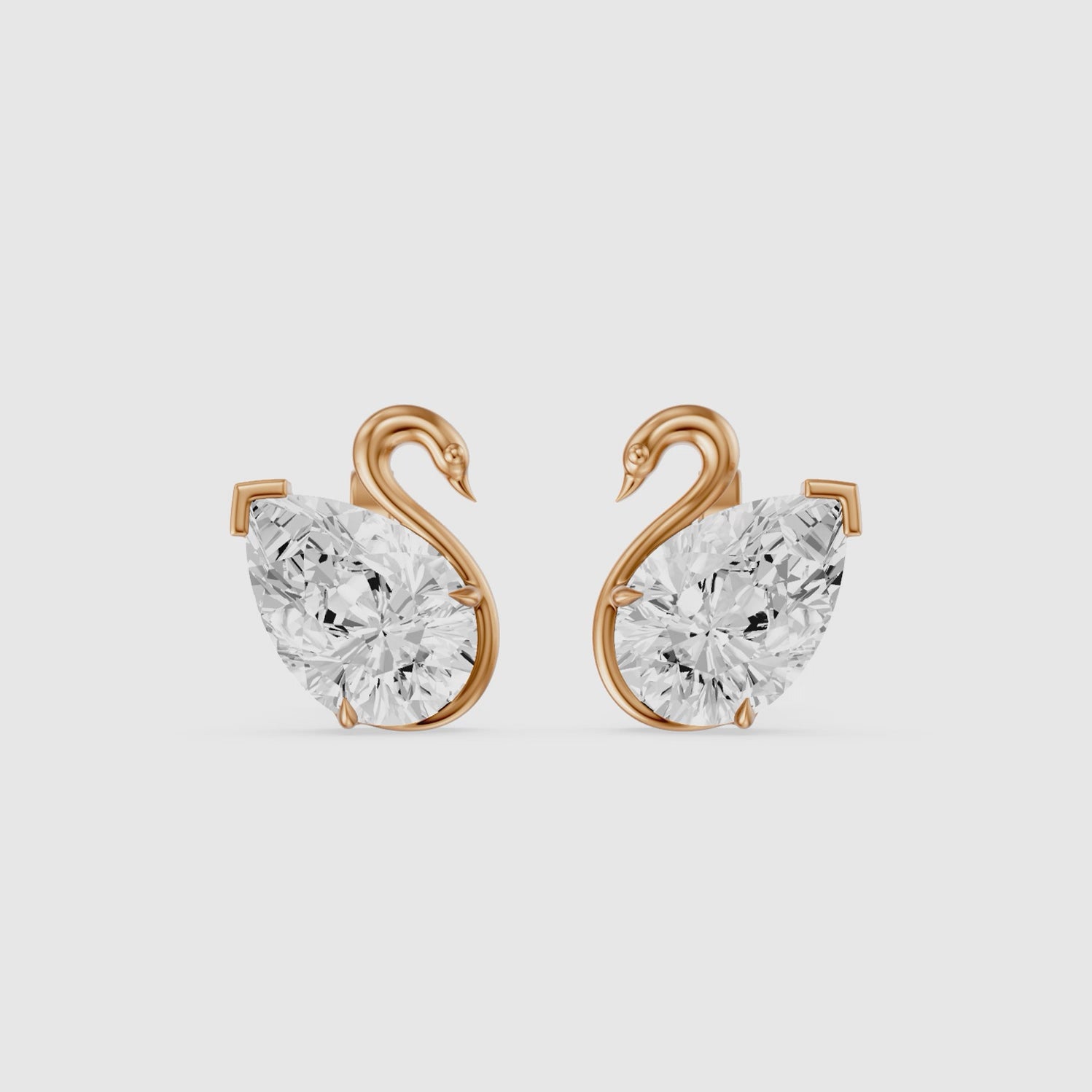 Load video: Solene Pear Cut Lab Grown Diamond Swan Stud Earrings