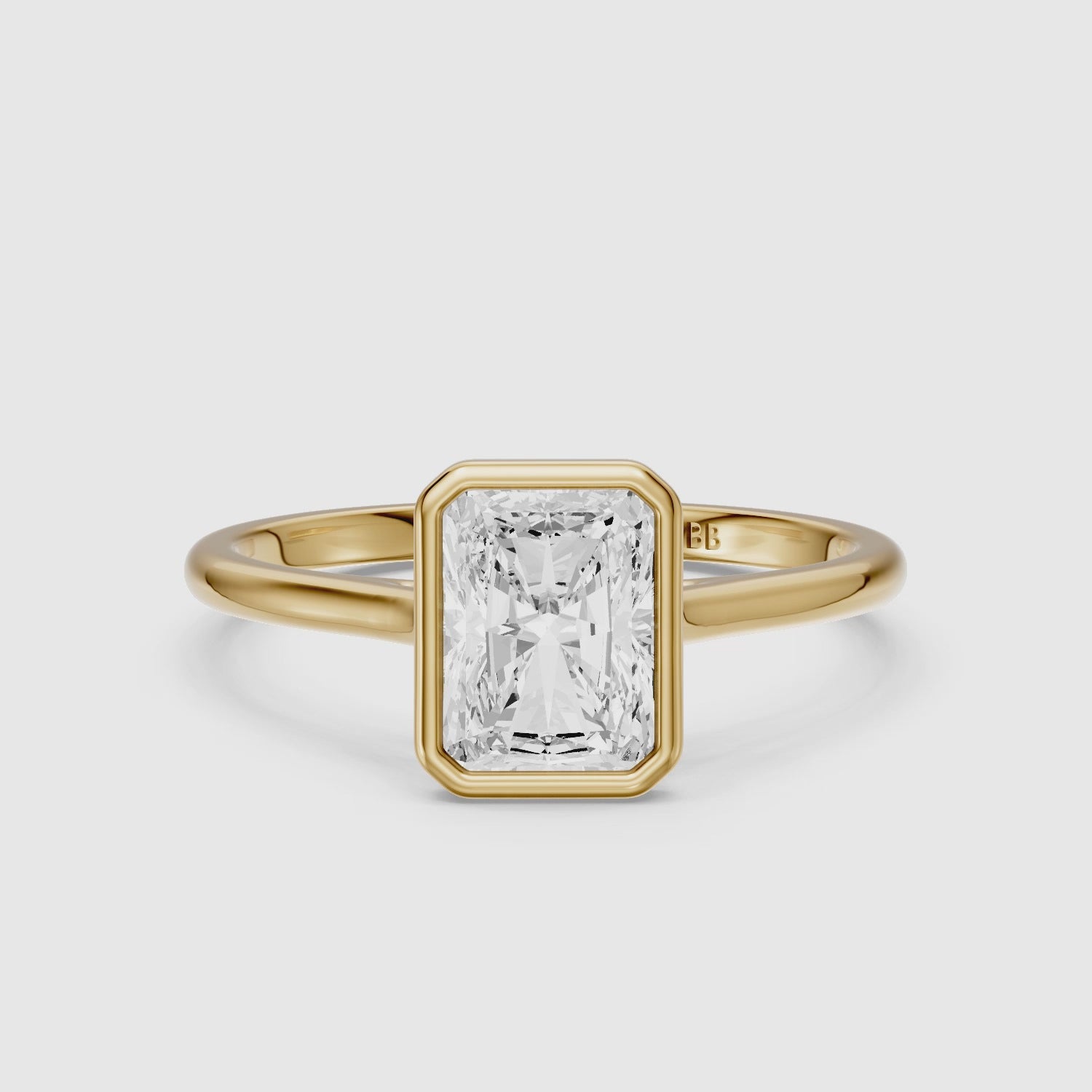 Load video: Emmaly Radiant Cut Bezel Cathedral Style Moissanite Diamond Ring