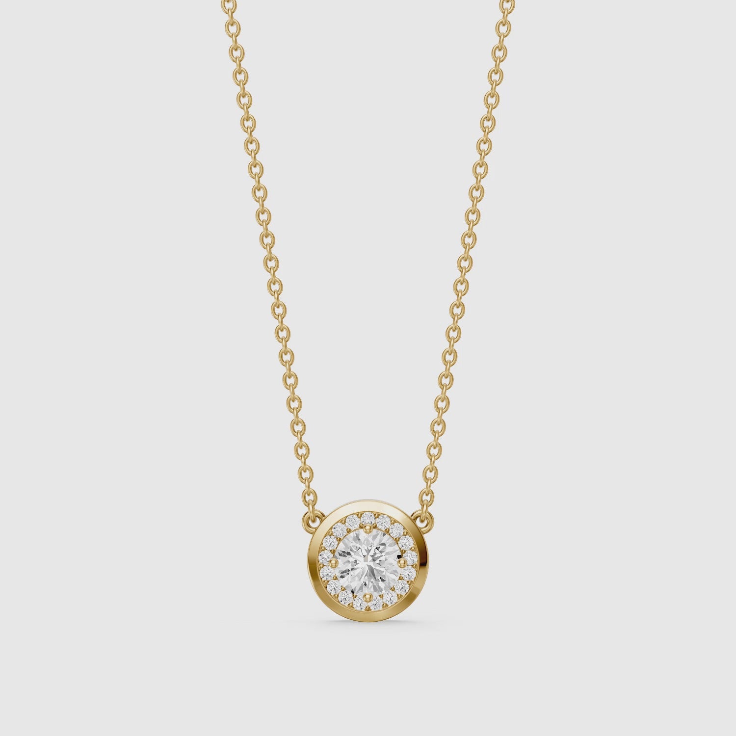 Load video: Marcella Bezel Set Round Lab Grown Diamond Halo Pendant