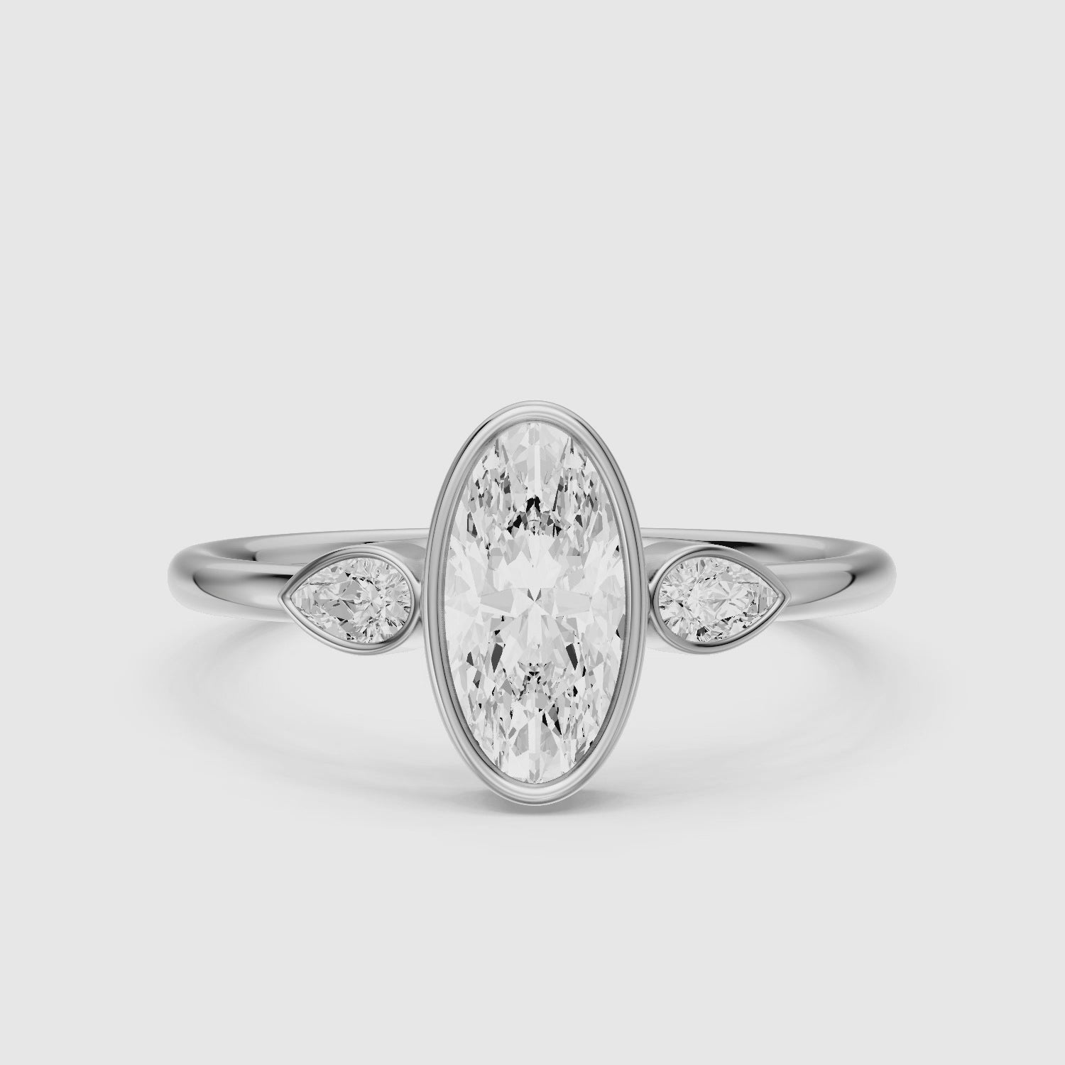 Load video: Eliza Moval Moissanite Diamond Bezel Ring with Pear Side Stones