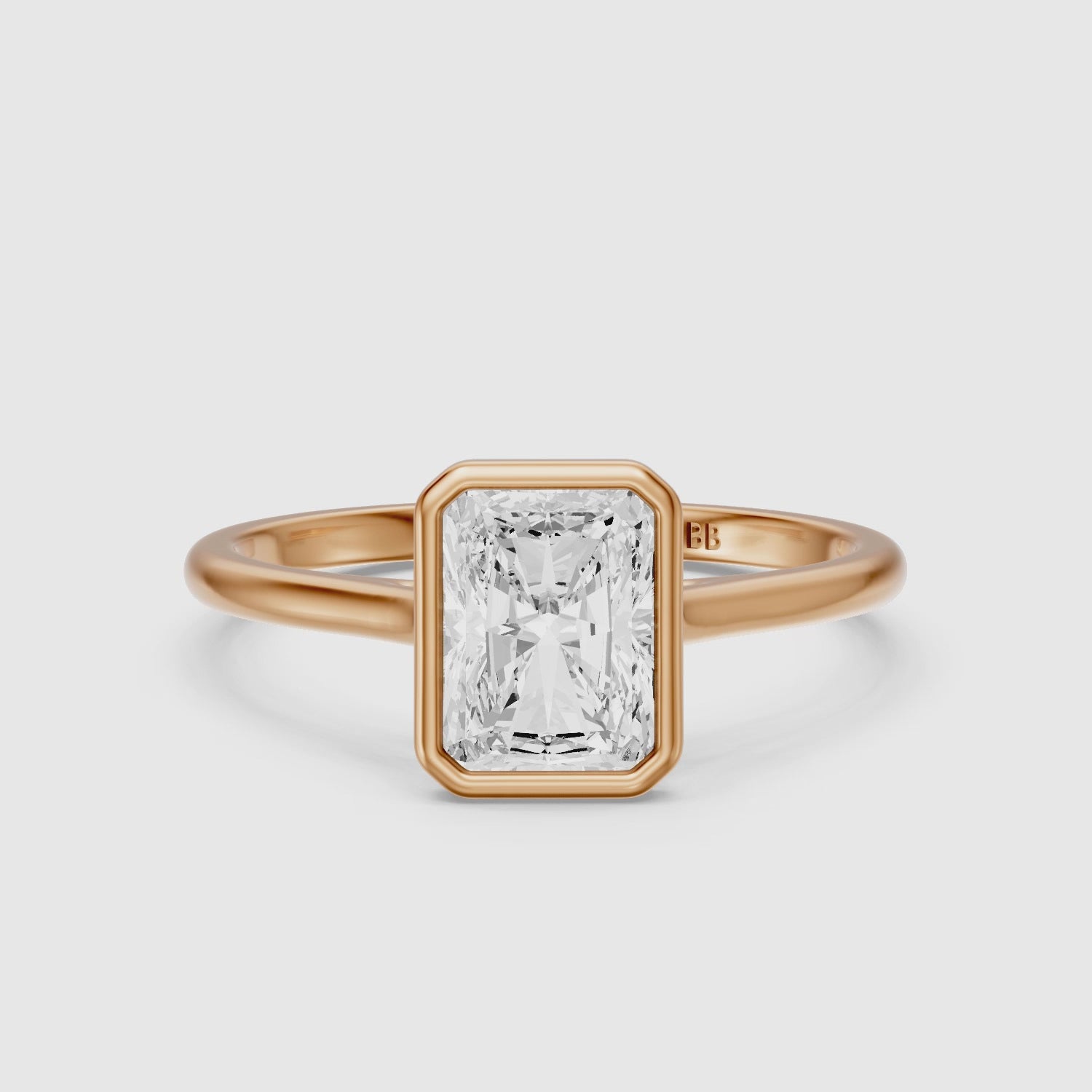 Load video: Emmaly Radiant Cut Bezel Cathedral Style Moissanite Diamond Ring