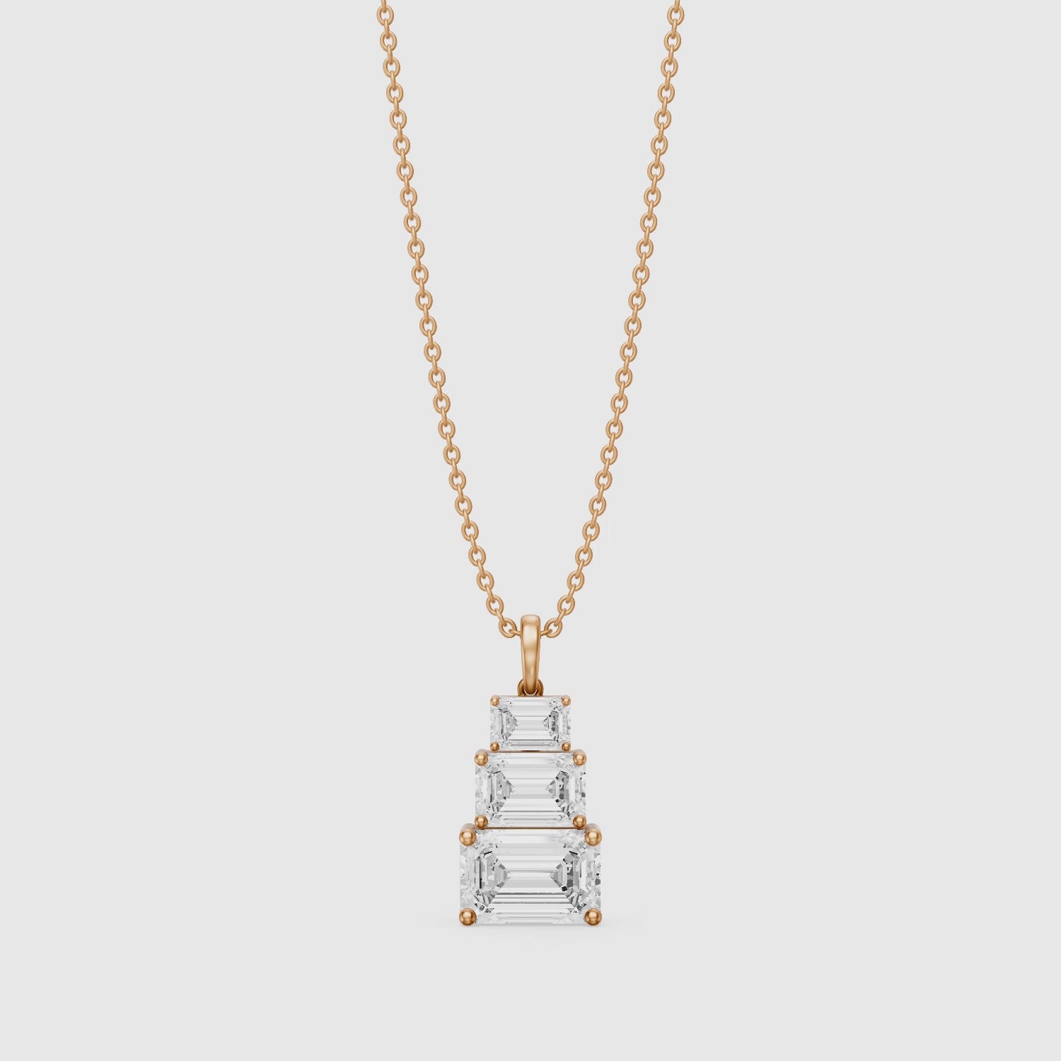 Load video: Carla Emerald Cut Lab Grown Diamond Graduated Pendant