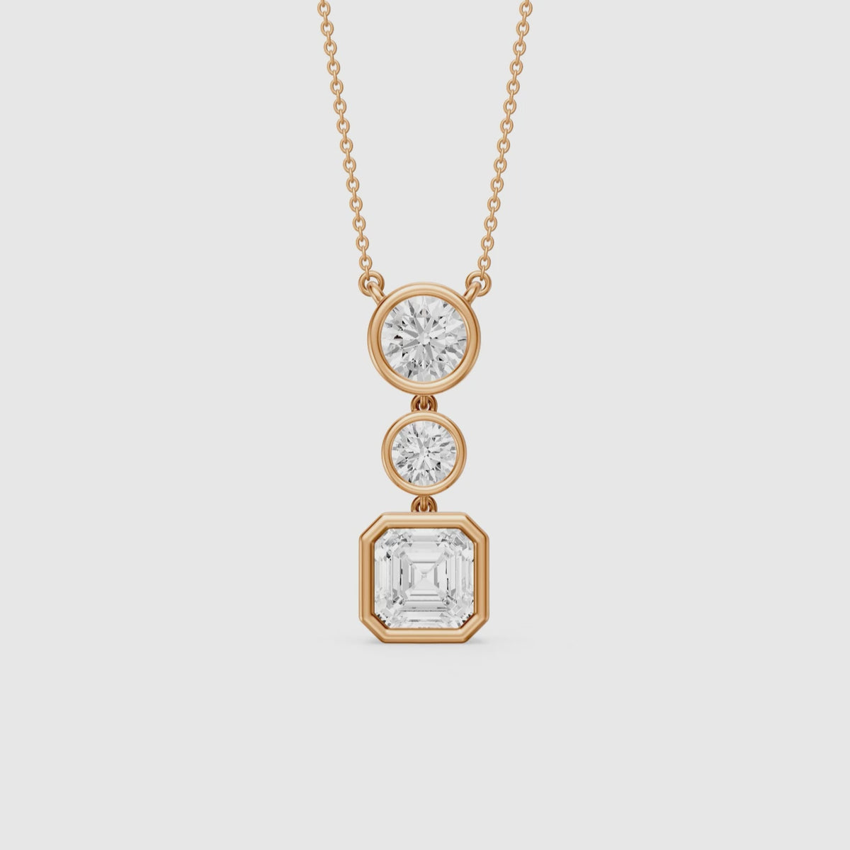 Load video: Vanessa Asscher Cut and Round Cut Lab Grown Diamond Bezel Three Stone Pendant