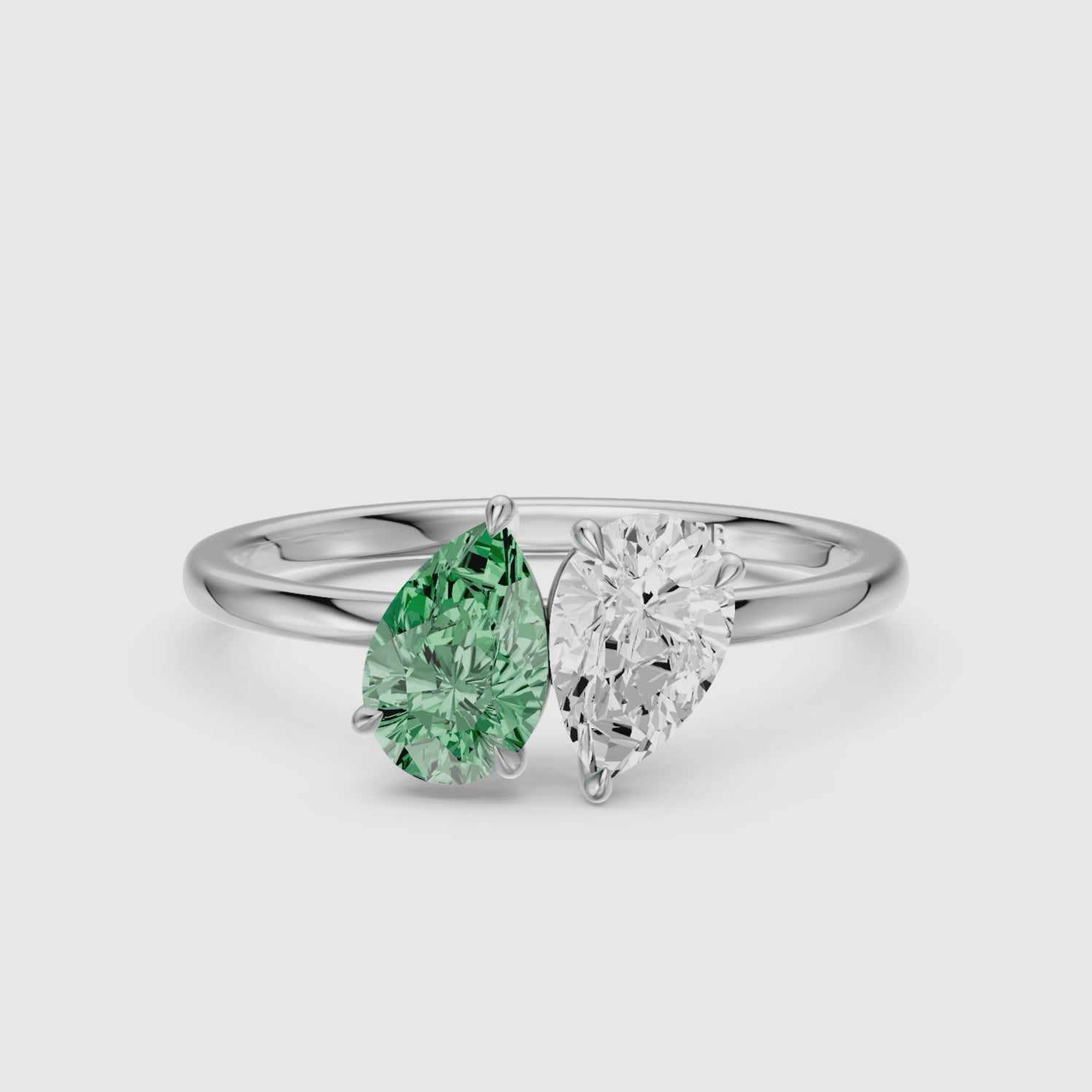 Load video: Asta Green and White Both Pear Cut Color Lab Grown Diamond Toi et Moi Ring