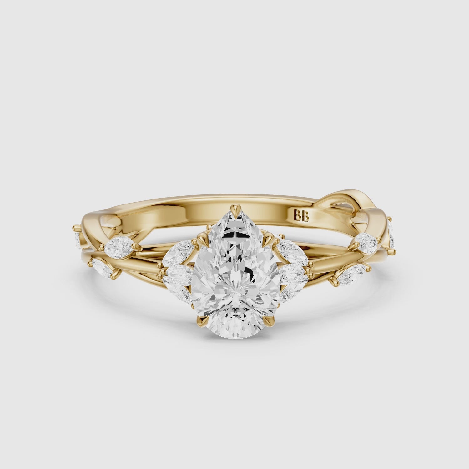 Load video: Luna Pear Cut Marquise Side Stone Nature Inspired Moissanite Diamond Ring