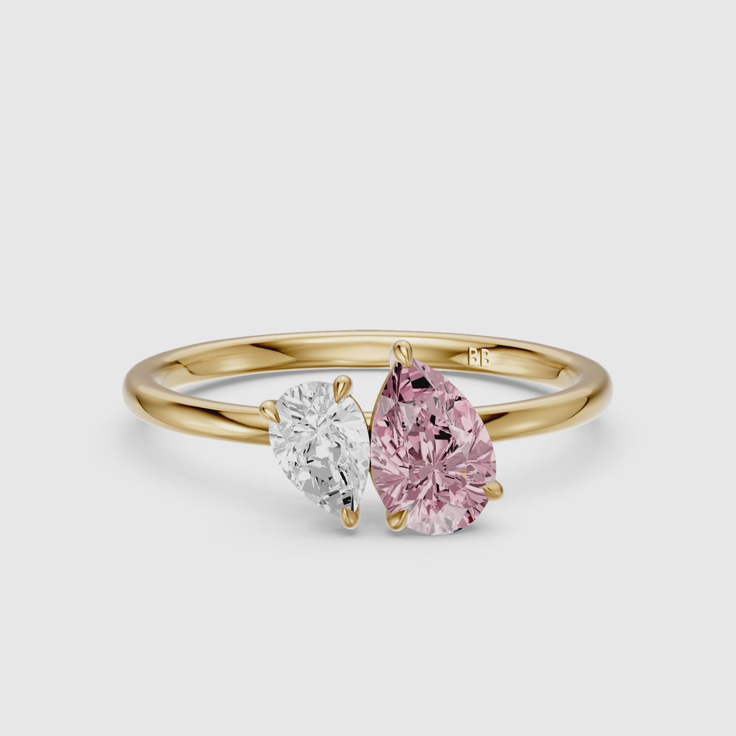 Load video: Kasia Pink and White Graduated Pear Shape Color Lab Grown Diamond Toi et Moi Ring