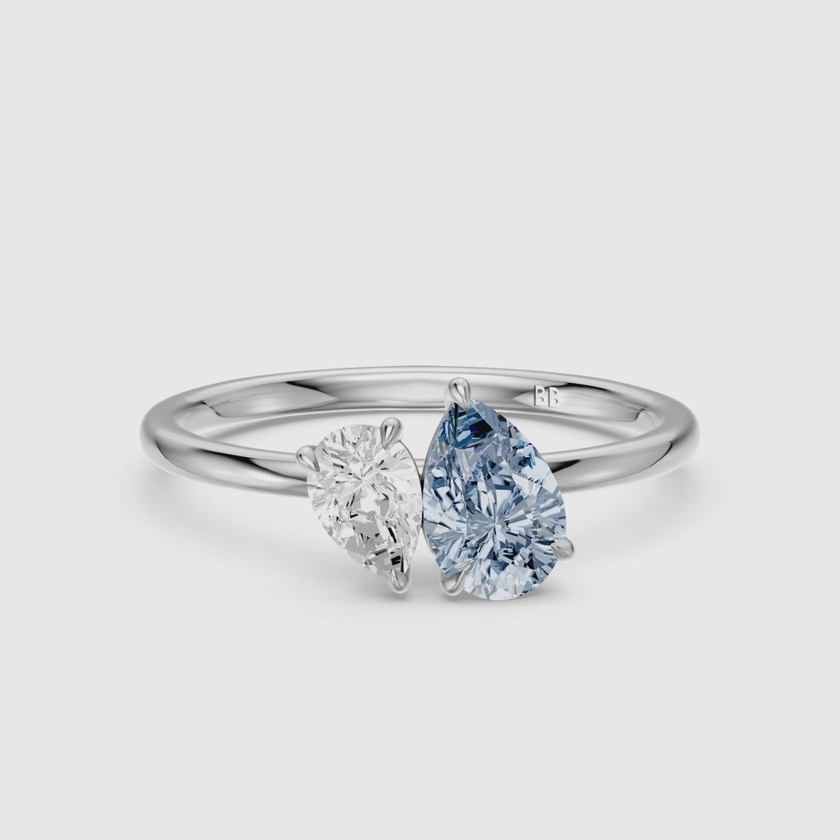 Load video: Livia Blue and White Graduated Pear Shape Color Lab Grown Diamond Toi et Moi Ring
