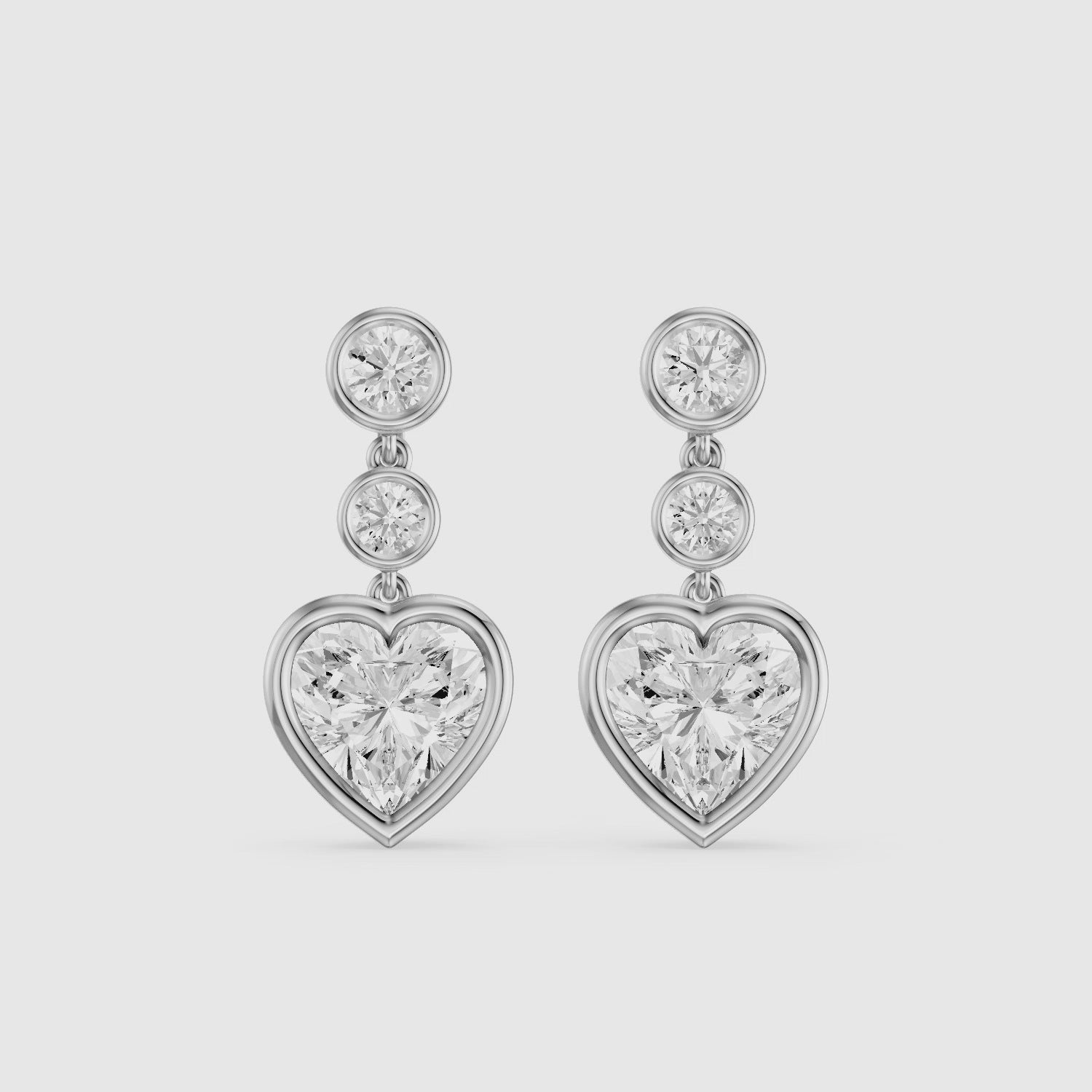 Load video: Ava Heart Shape and Round Lab Grown Diamond Bezel Drop Earrings