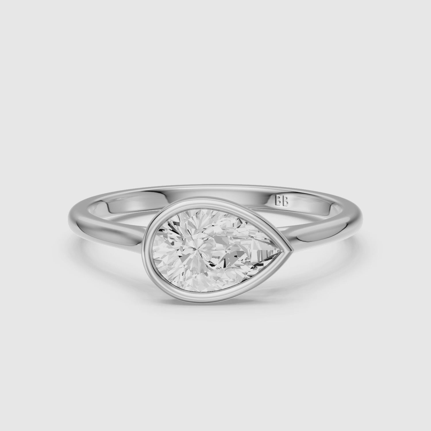 Load video: Madison Pear Cut East West Bezel Lab Grown Diamond Engagement Ring