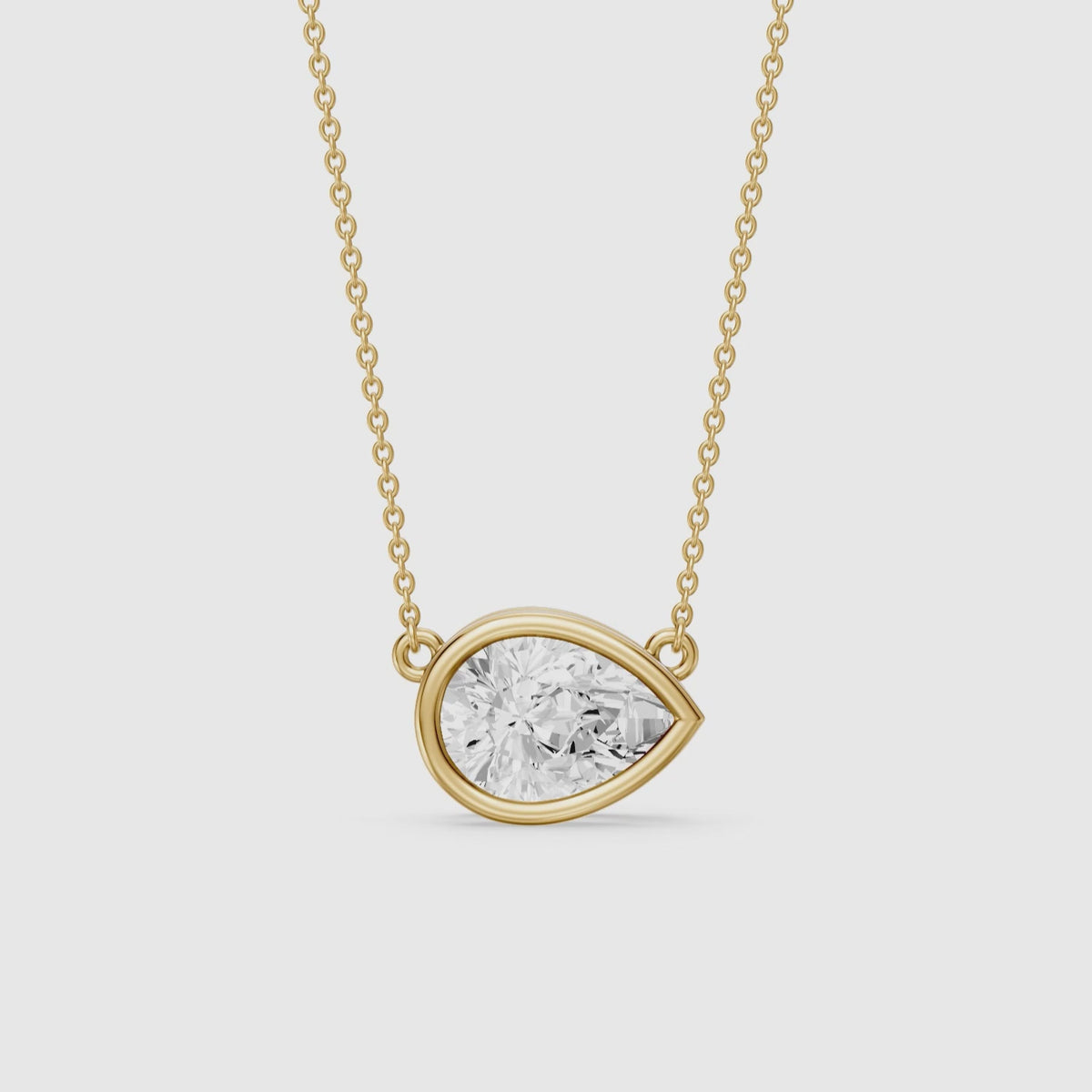 Load video: Sydney East West Pear Shape Lab Grown Diamond Bezel Pendant
