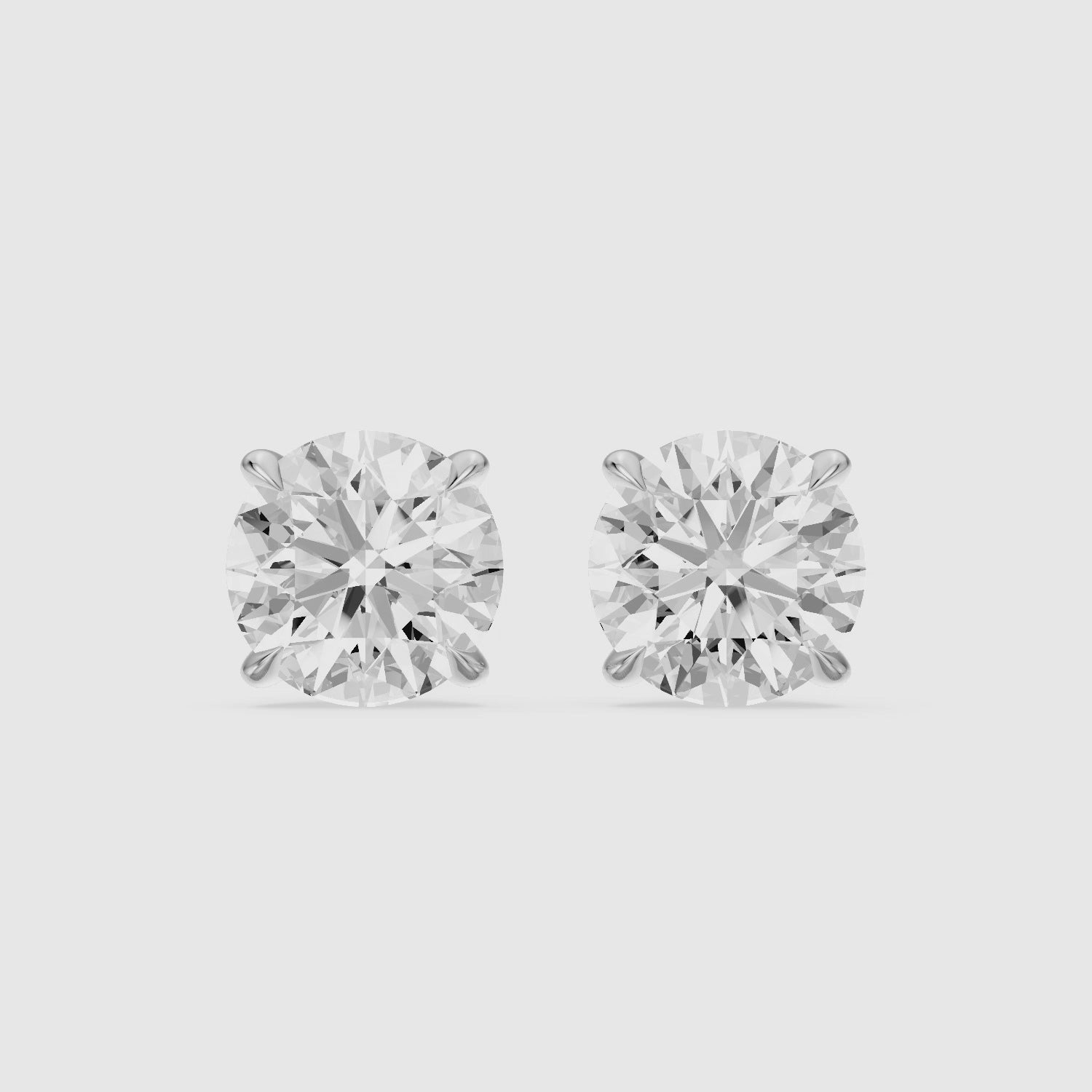 Load video: Roos Round Cut Lab Grown Diamond Four Prong Martini Earrings