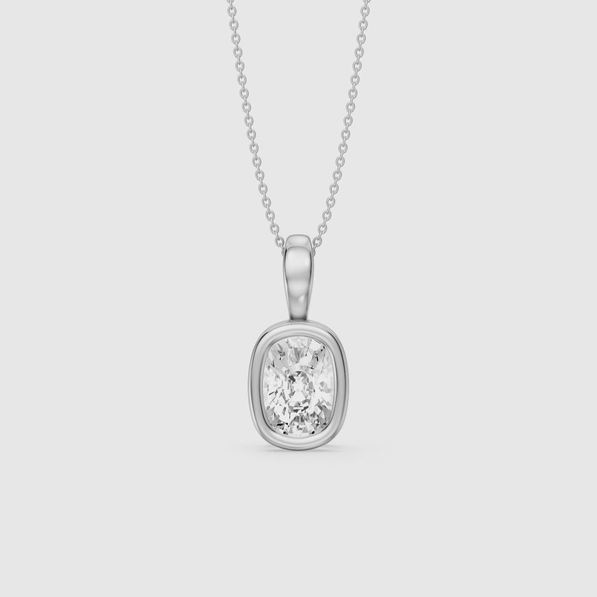 Load video: Lizzy Elongated Cushion Bezel Lab Grown Diamond Solitaire Pendant