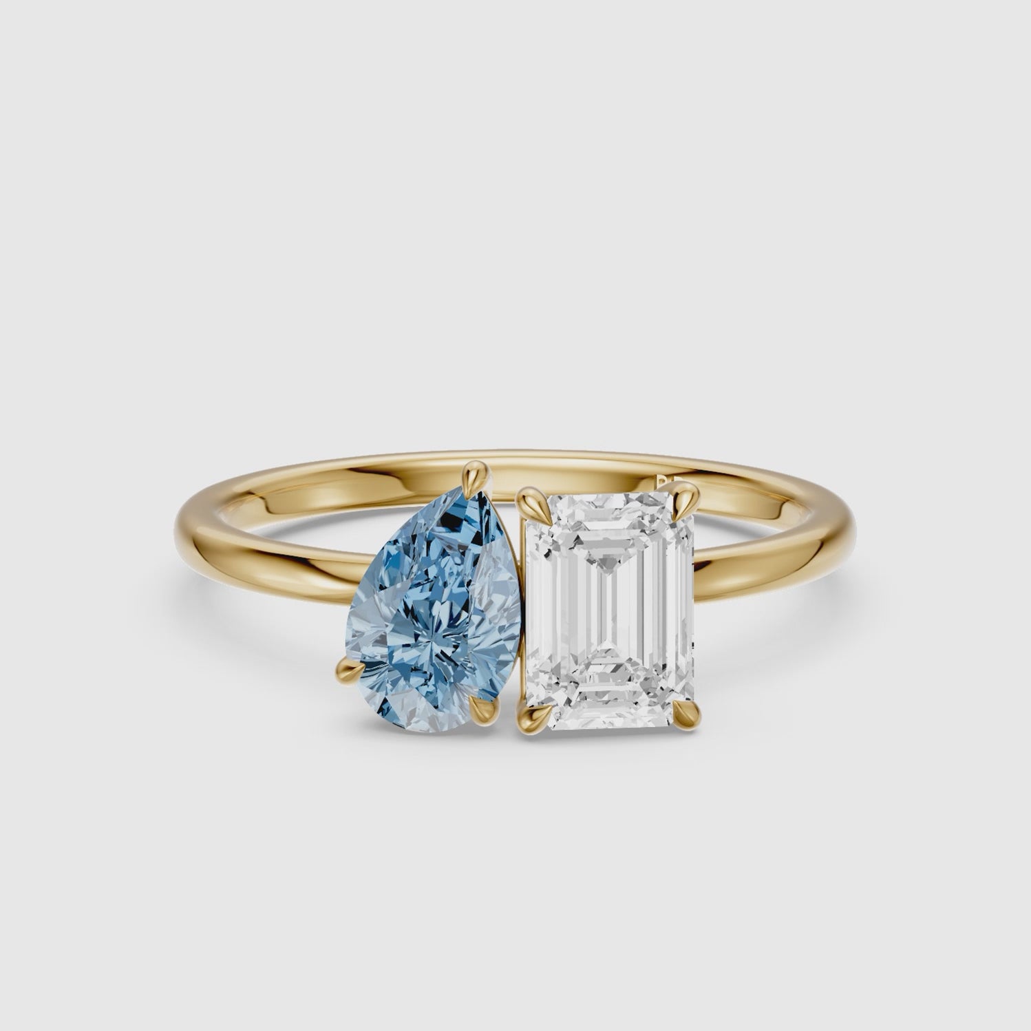 Load video: Eliska Blue Pear and Emerald Cut Color Lab Grown Diamond Toi et Moi Ring