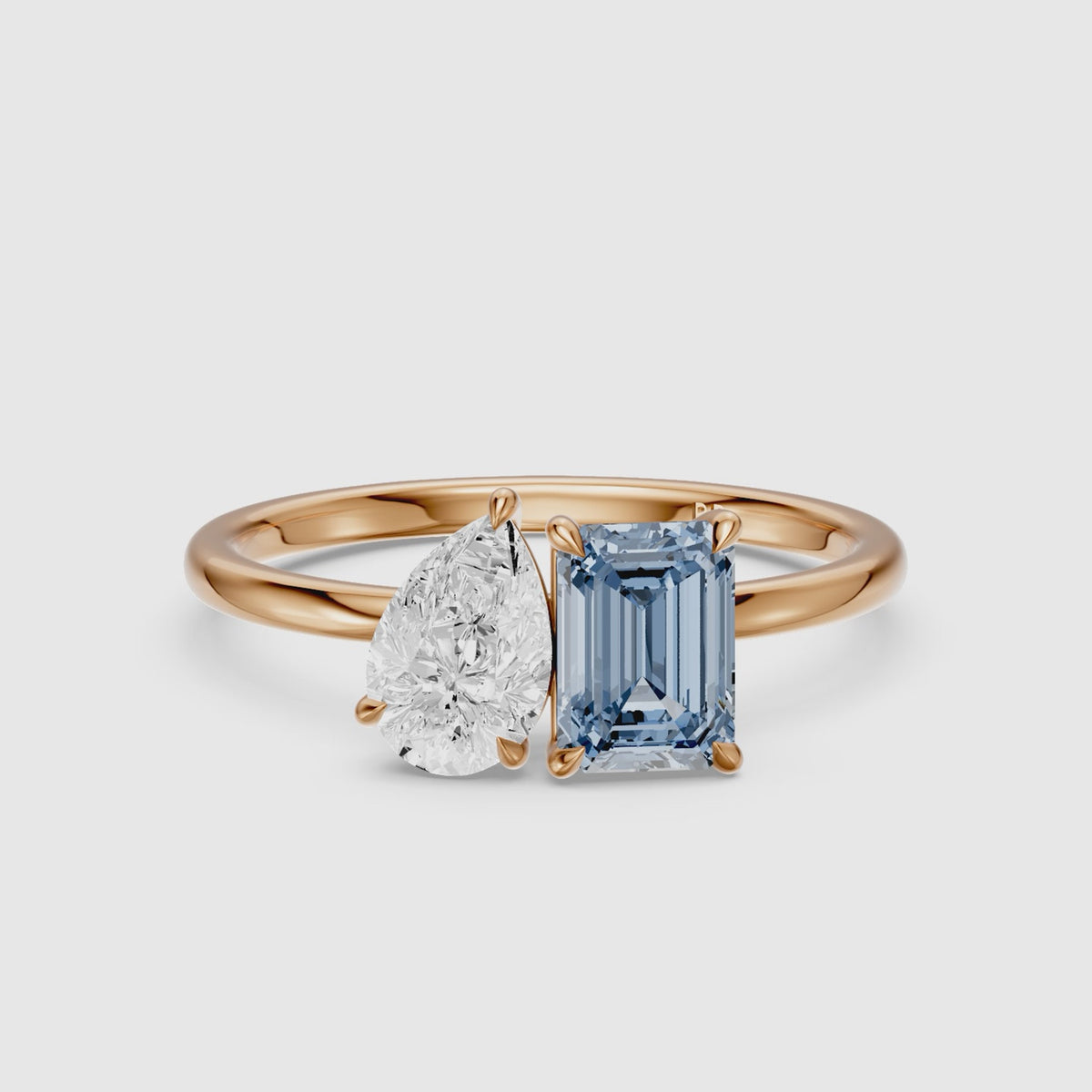 Load video: Runa Blue Emerald Cut and Pear Shape Color Lab Grown Diamond Toi et Moi Ring