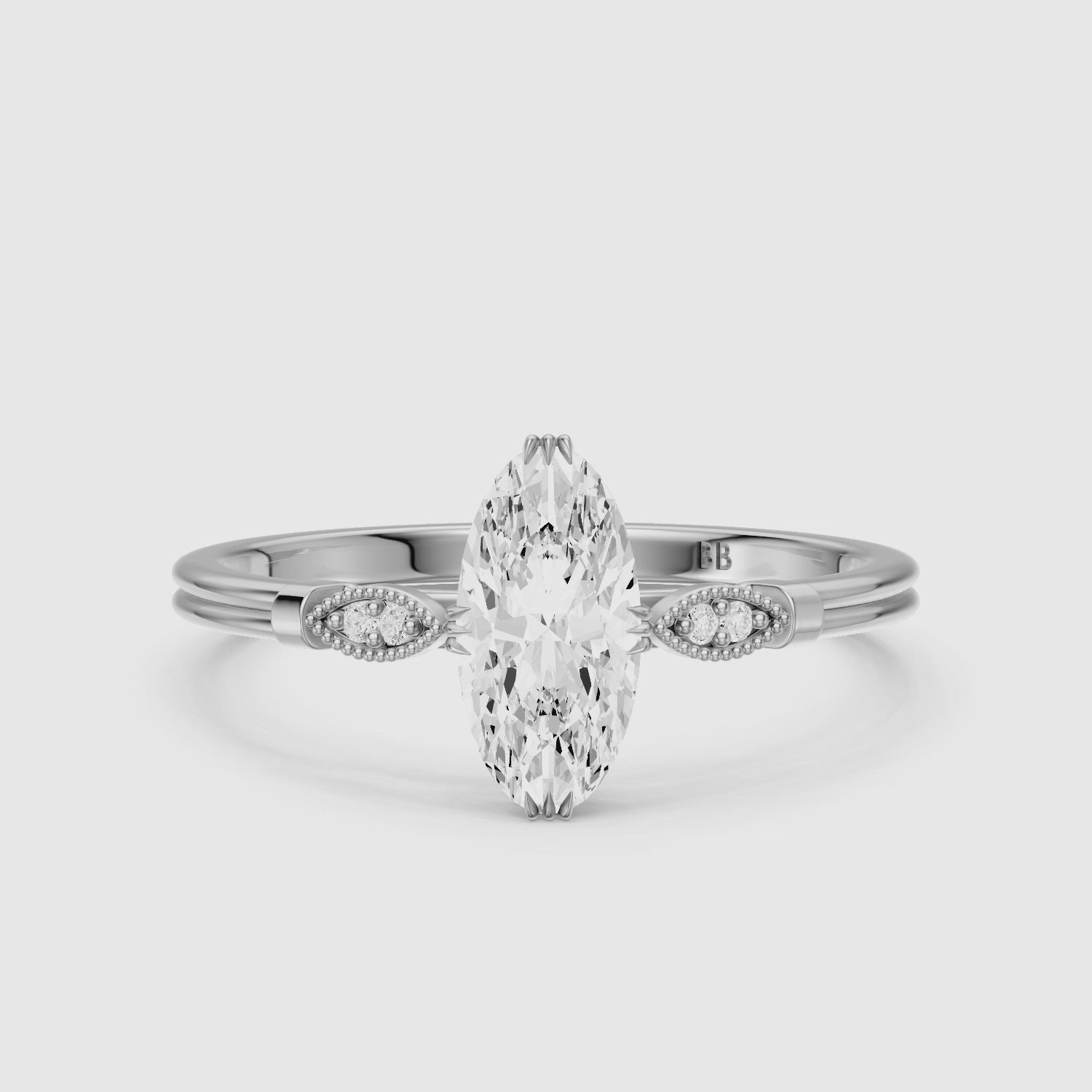 Load video: Serena Moval Cut Side Stone Moissanite Diamond Ring with Triple Claw Prongs