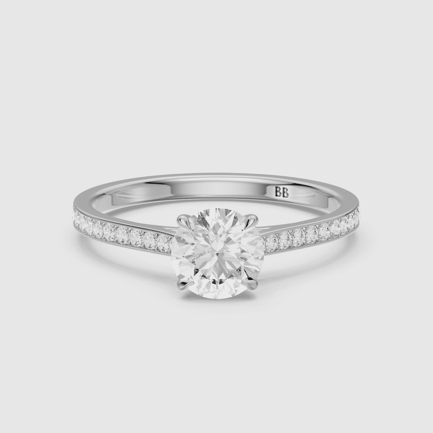 Load video: Jolene 4 Prong Round Cut Side Stone Channel Set Lab Grown Diamond Ring