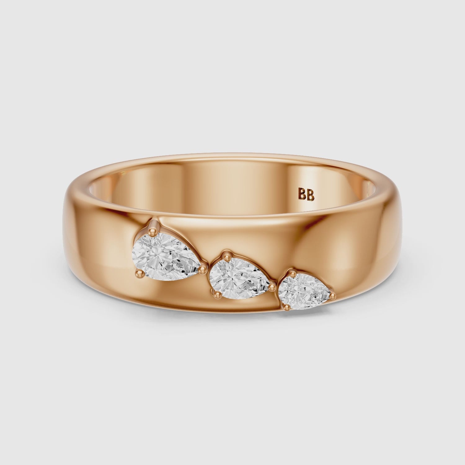 Load video: Britta Pear Cut Lab Diamond Graduated Three Stone Cigar Band
