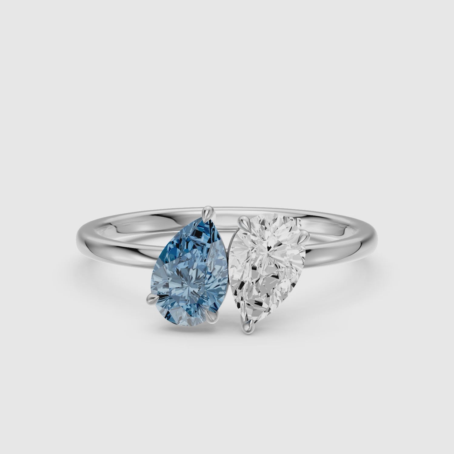 Load video: Axelle Blue and White Both Pear Cut Color Lab Grown Diamond Toi et Moi Ring