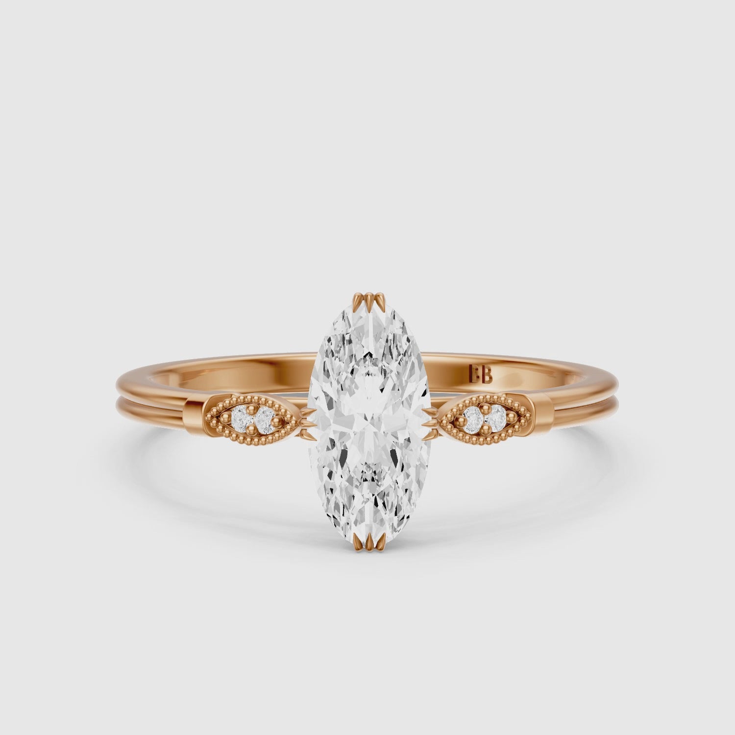 Load video: Serena Moval Cut Side Stone Moissanite Diamond Ring with Triple Claw Prongs