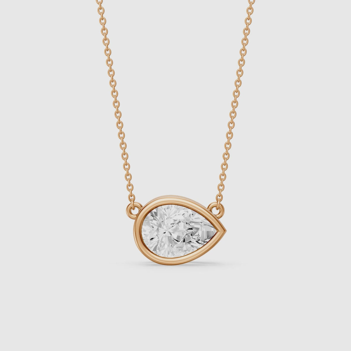 Load video: Sydney East West Pear Shape Lab Grown Diamond Bezel Pendant