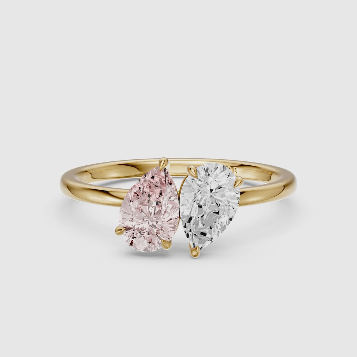 Load video: Audra Pink and White Both Pear Cut Color Lab Grown Diamond Toi et Moi Ring