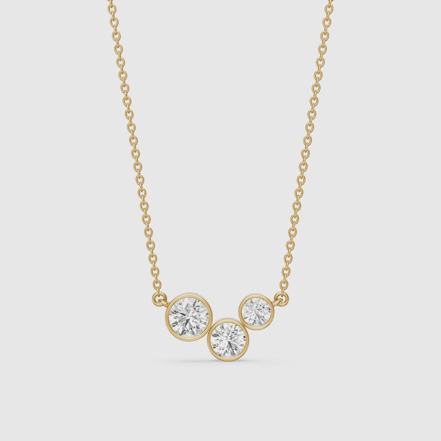 Load video: Hoorain Three Stone Round Lab Grown Diamond Bezel Pendant