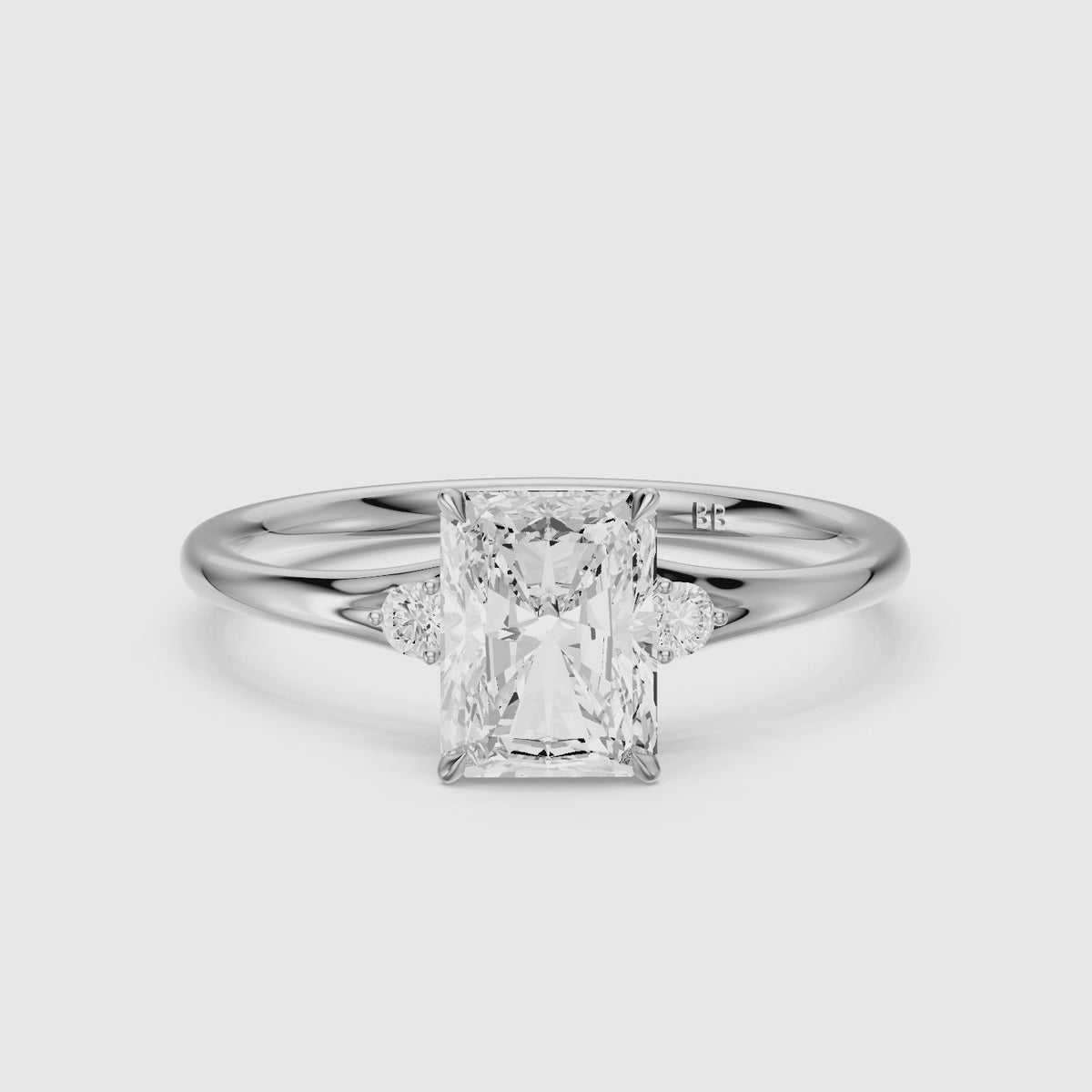 Load video: Lumi Radiant Cut Side Stone Sculptural Moissanite Diamond Ring