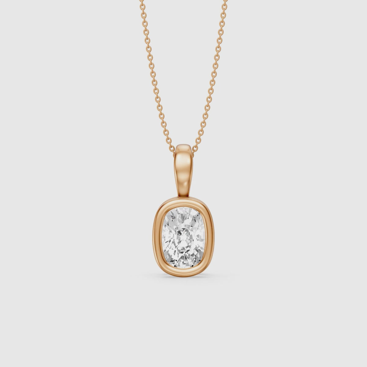 Load video: Lizzy Elongated Cushion Bezel Lab Grown Diamond Solitaire Pendant