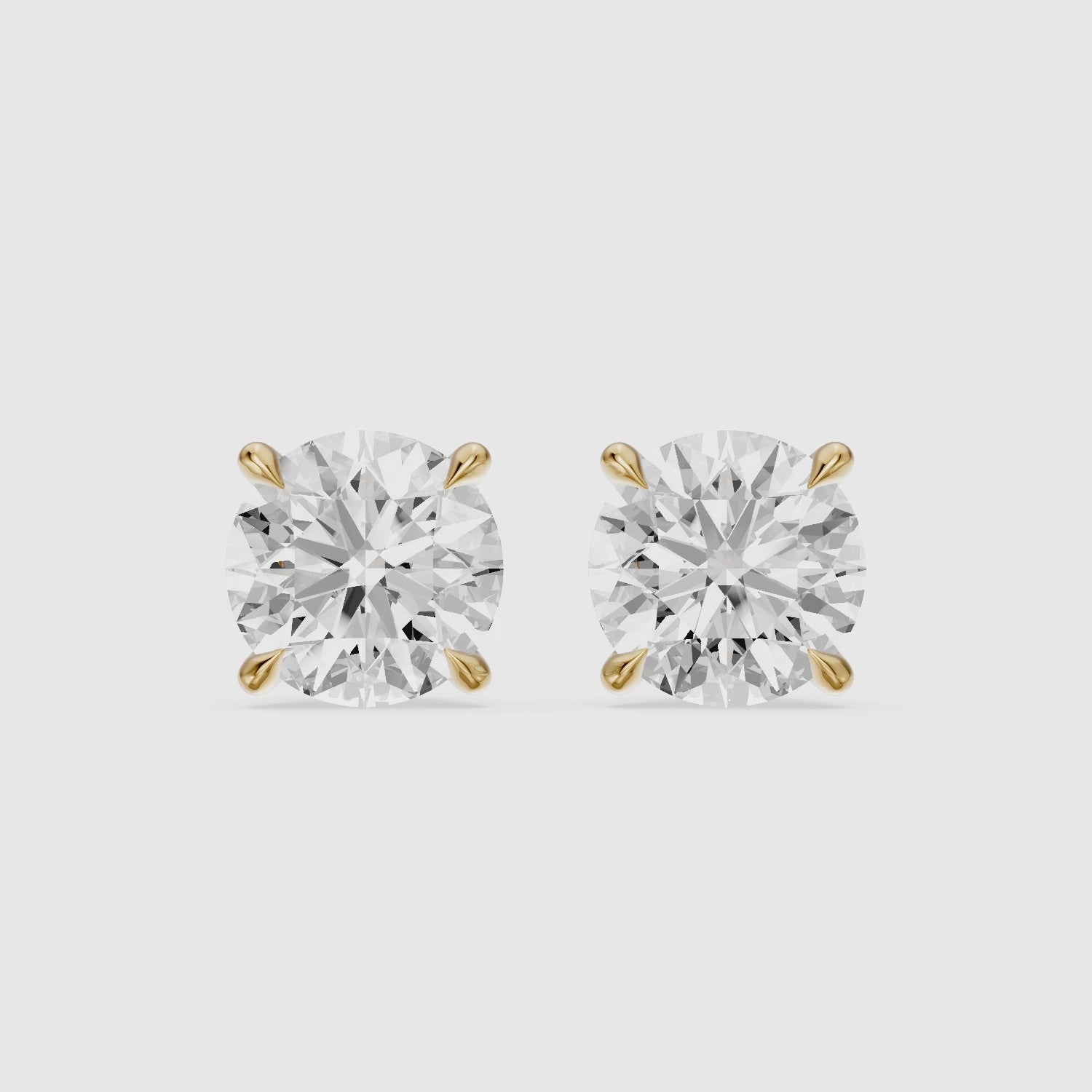 Load video: Polina Round Cut Lab Grown Diamond Hidden Halo Solitaire Earrings