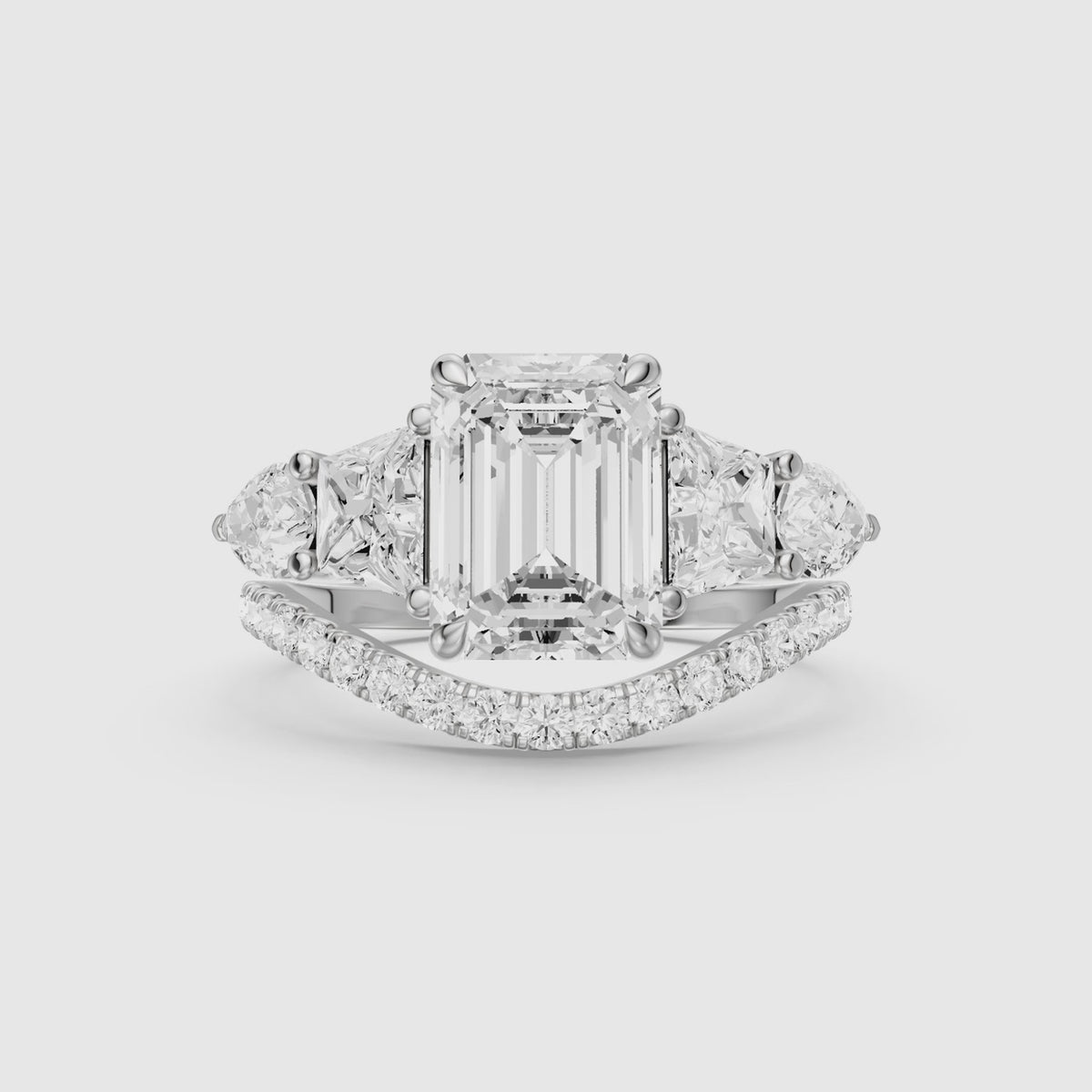Load video: Nyla Five Stone Emerald Cut Lab Grown Diamond Bridal Set with Curved Pave Band