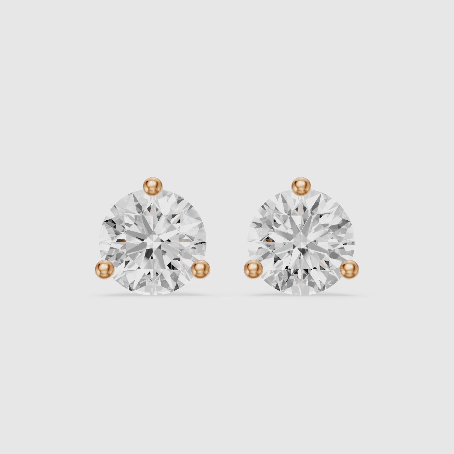 Load video: Gaia Round Cut Lab Grown Diamond Three Prong Martini Stud Earrings