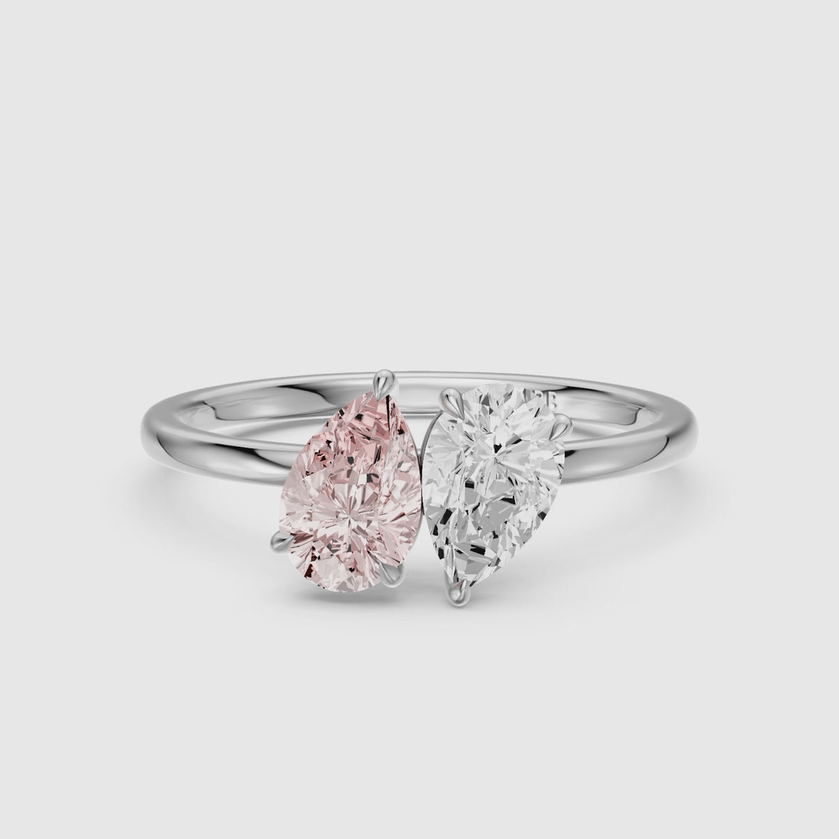 Load video: Audra Pink and White Both Pear Cut Color Lab Grown Diamond Toi et Moi Ring