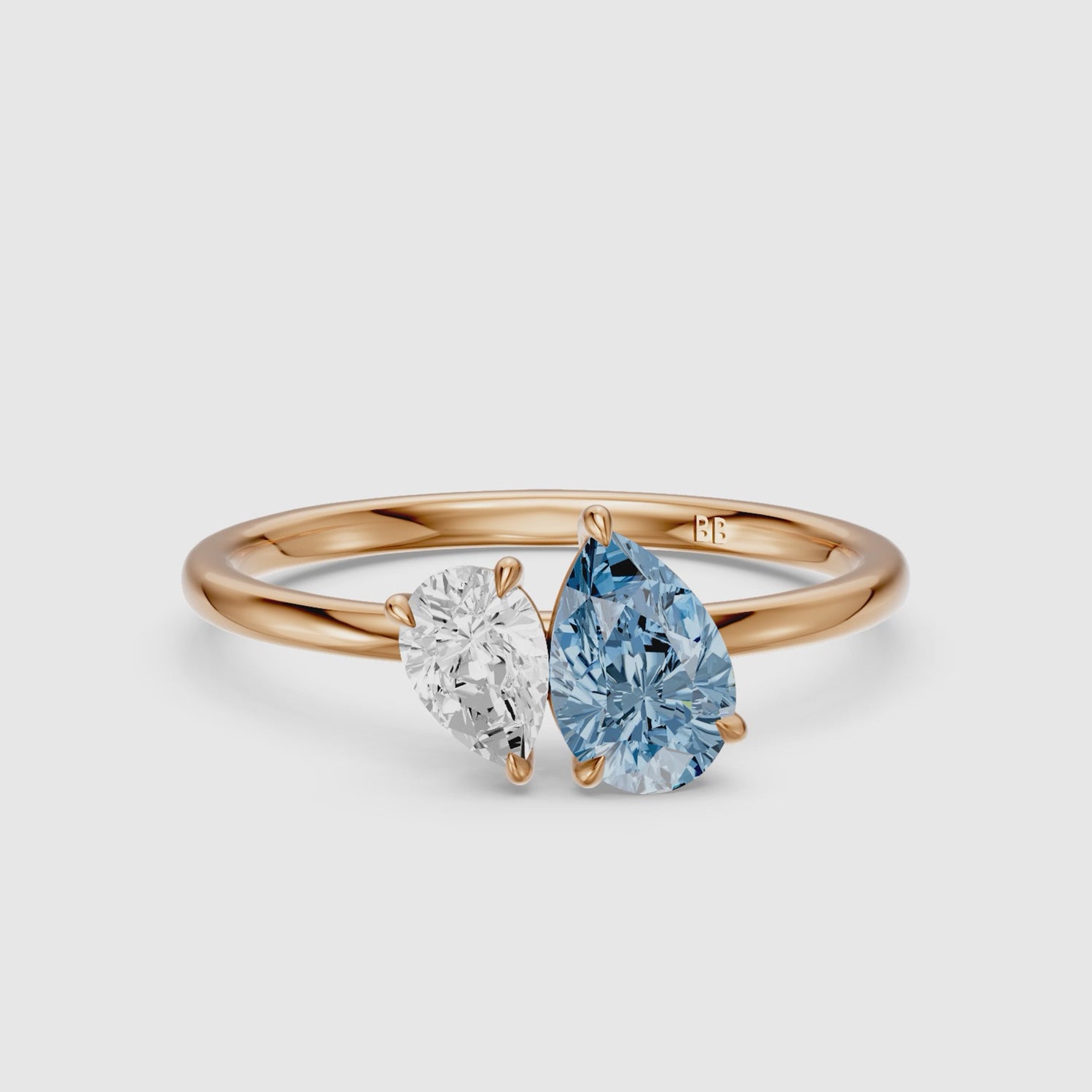 Load video: Livia Blue and White Graduated Pear Shape Color Lab Grown Diamond Toi et Moi Ring