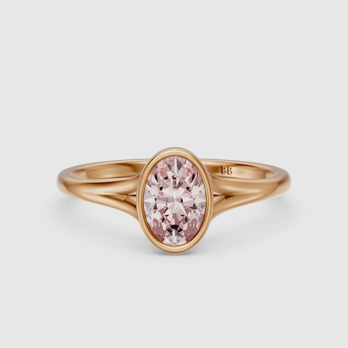 Load video: Elliot Oval Cut Pink Lab Grown Diamond Ring in Bezel Set Split Shank Style