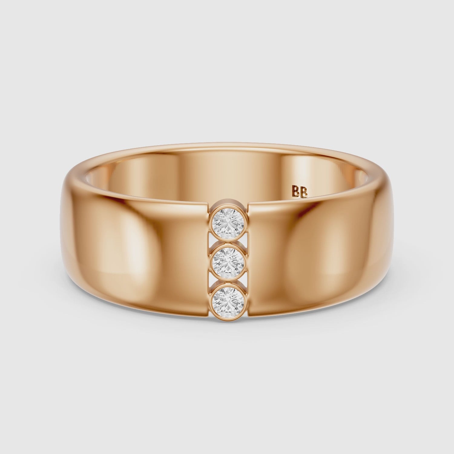 Load video: Chiara Round Cut Lab Diamond Bezel Set Three Stone Cigar Band