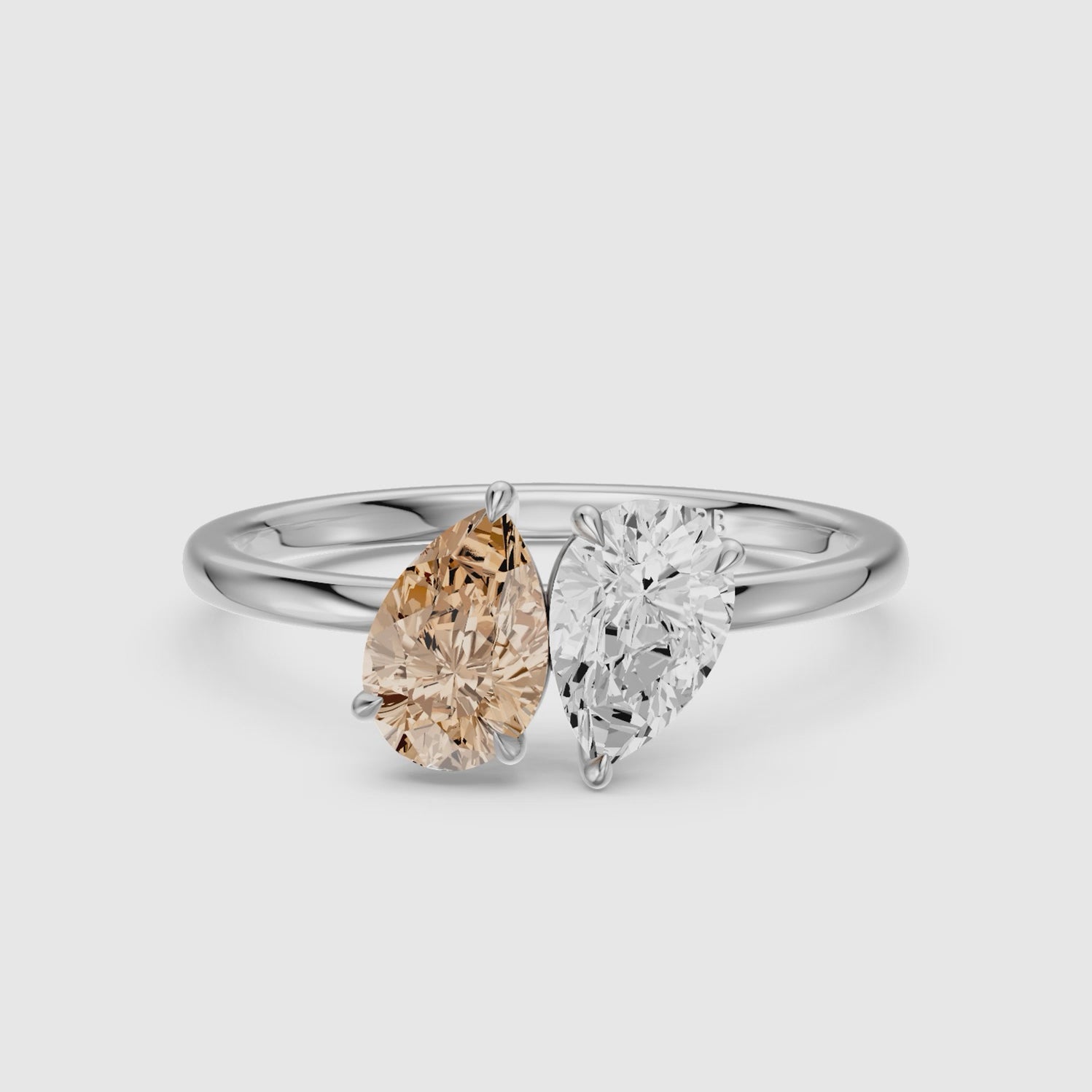 Load video: Alba Champagne and White Both Pear Cut Color Lab Grown Diamond Toi et Moi Ring