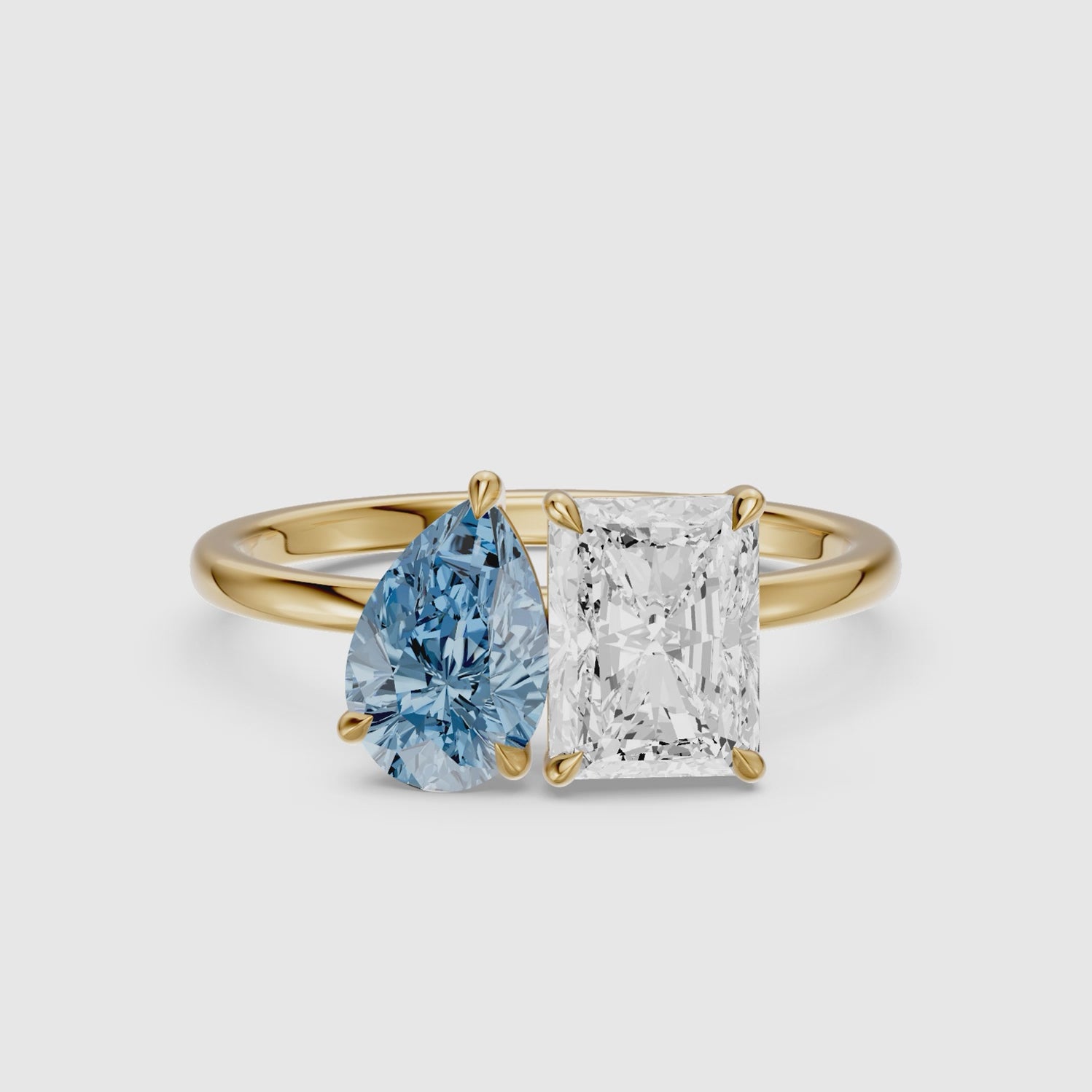 Load video: Eulalia Blue Pear and Radiant Cut Colored Lab Grown Diamond Toi et Moi Ring