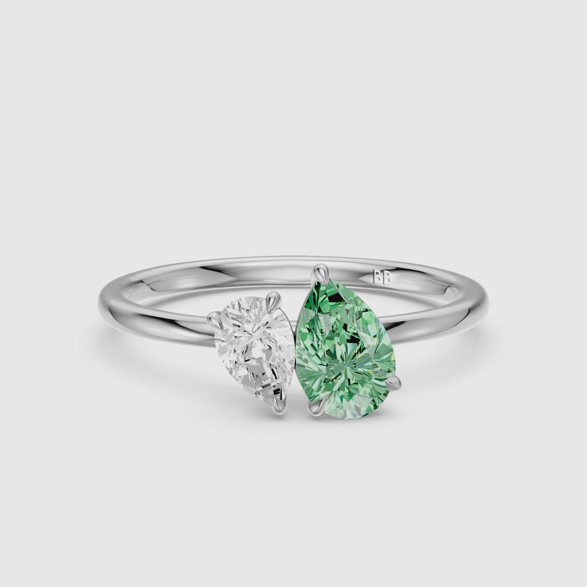 Load video: Irina Green and White Graduated Pear Shape Color Lab Grown Diamond Toi et Moi Ring