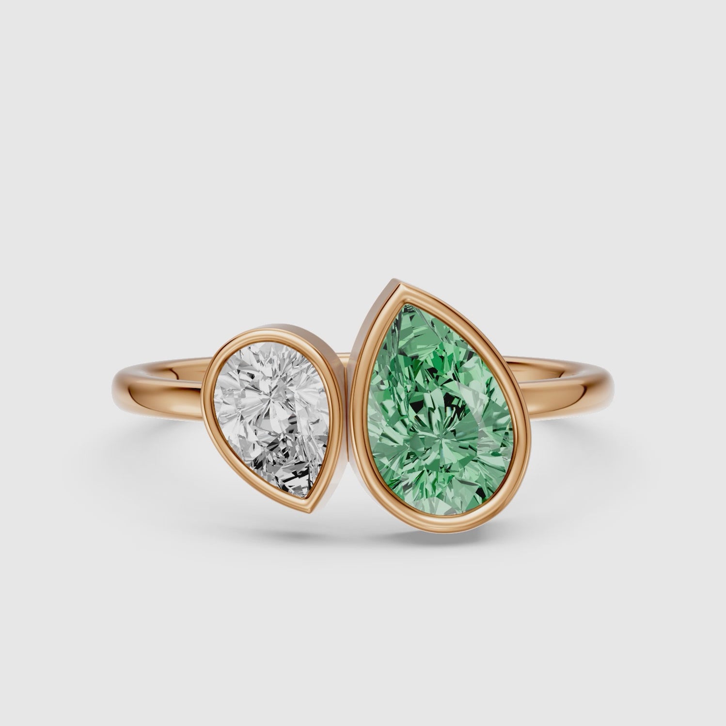 Load video: Oriana Green and White Pear Cut Colored Lab Grown Diamond Toi et Moi Bezel Ring