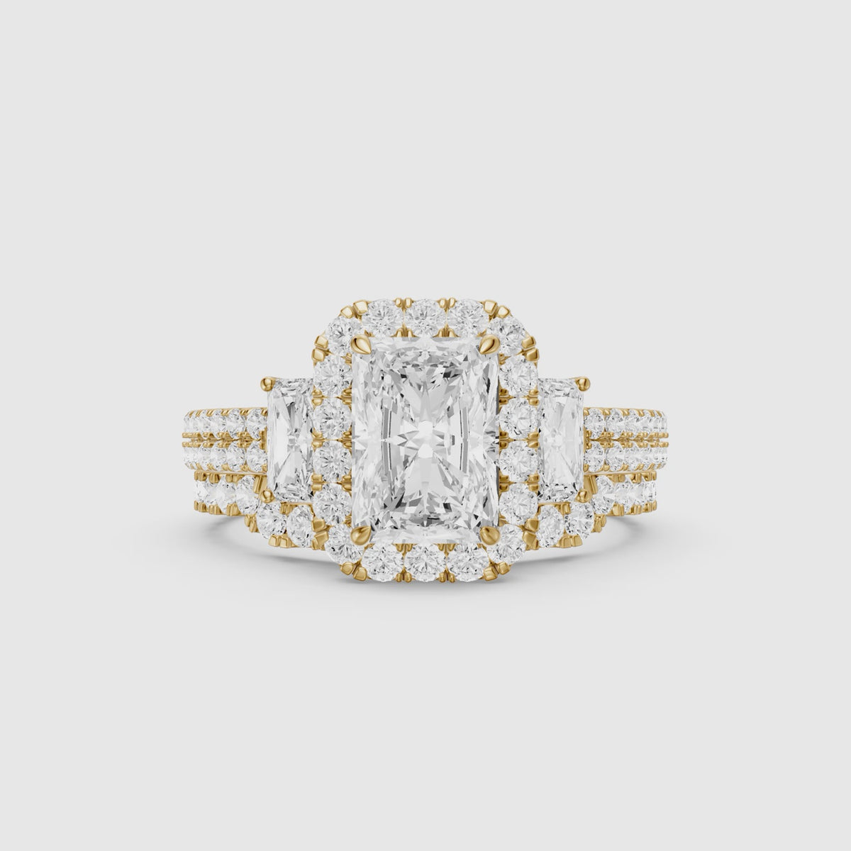 Load video: Seren Three Stone Radiant Cut Lab Grown Diamond Halo Bridal Set