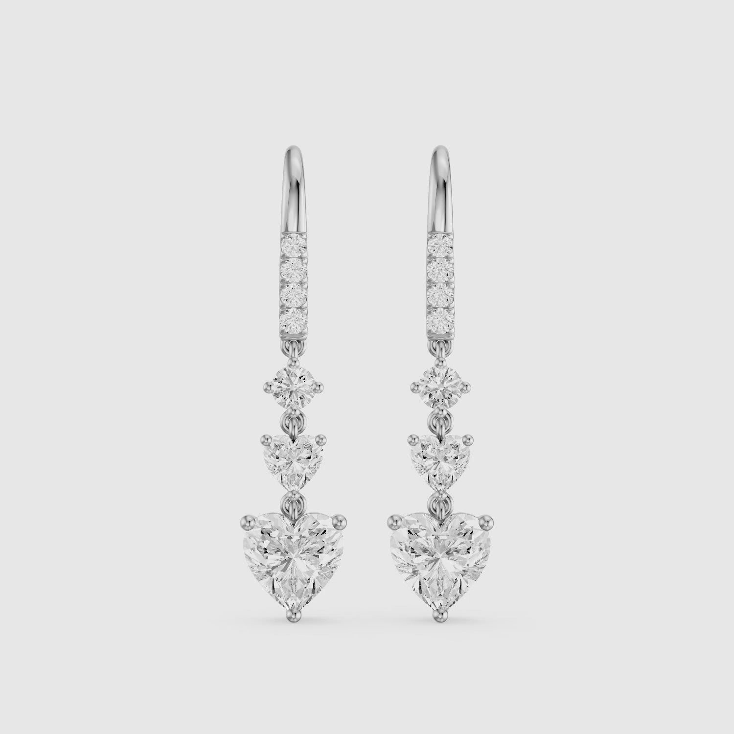 Load video: Yasmin Graduated Heart and Round Lab Grown Diamond Dangle Earrings