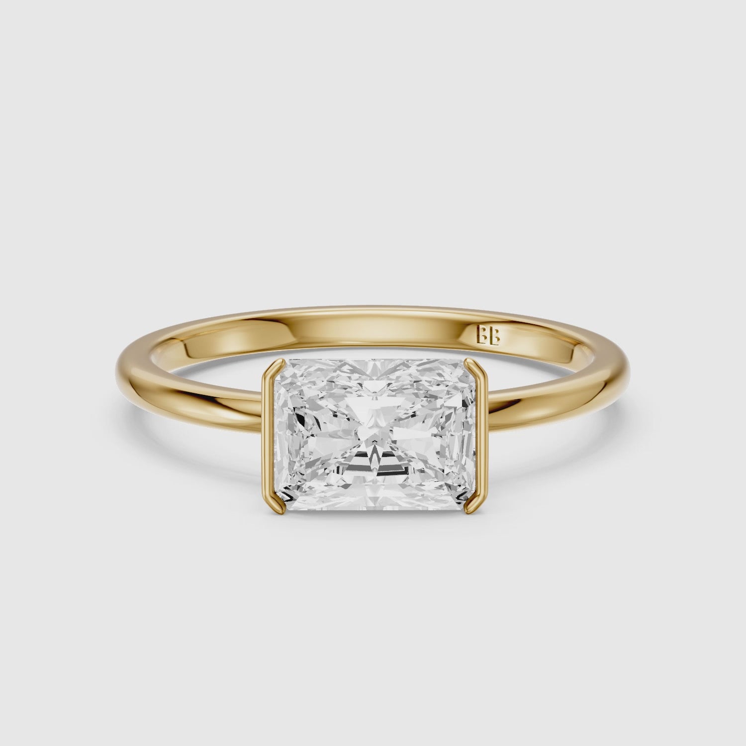 Load video: Penelope Radiant Cut East West Half Bezel Moissanite Diamond Ring