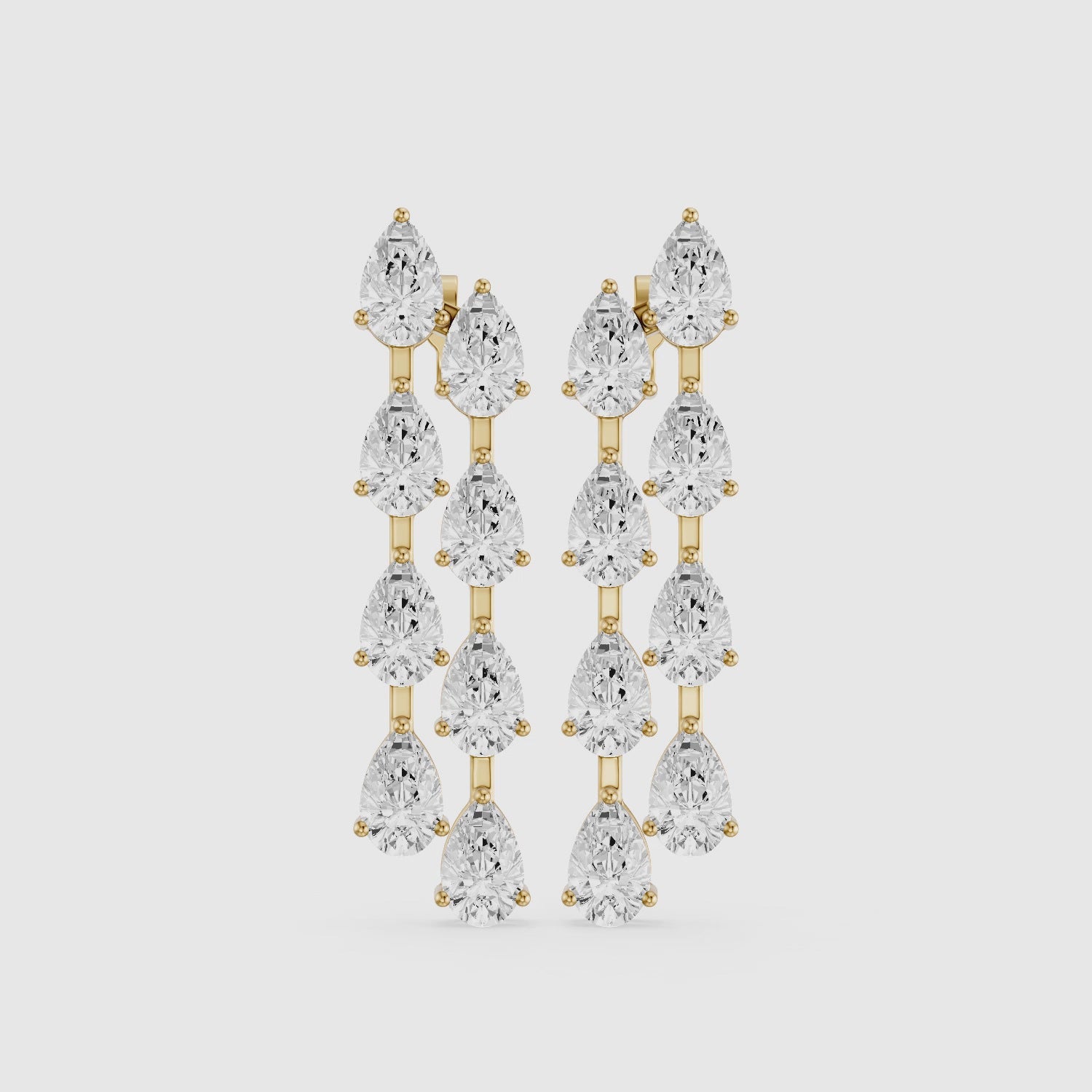 Load video: Eadie Cascading Pear Shaped Lab Grown Diamond Dangle Earrings