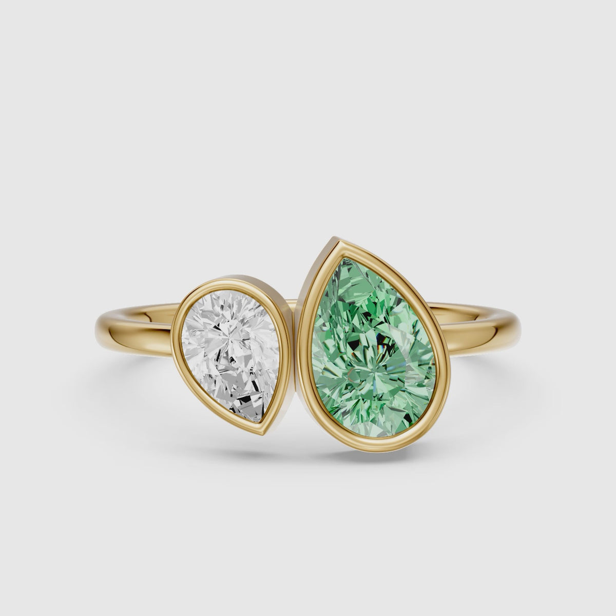 Load video: Oriana Green and White Pear Cut Colored Lab Grown Diamond Toi et Moi Bezel Ring
