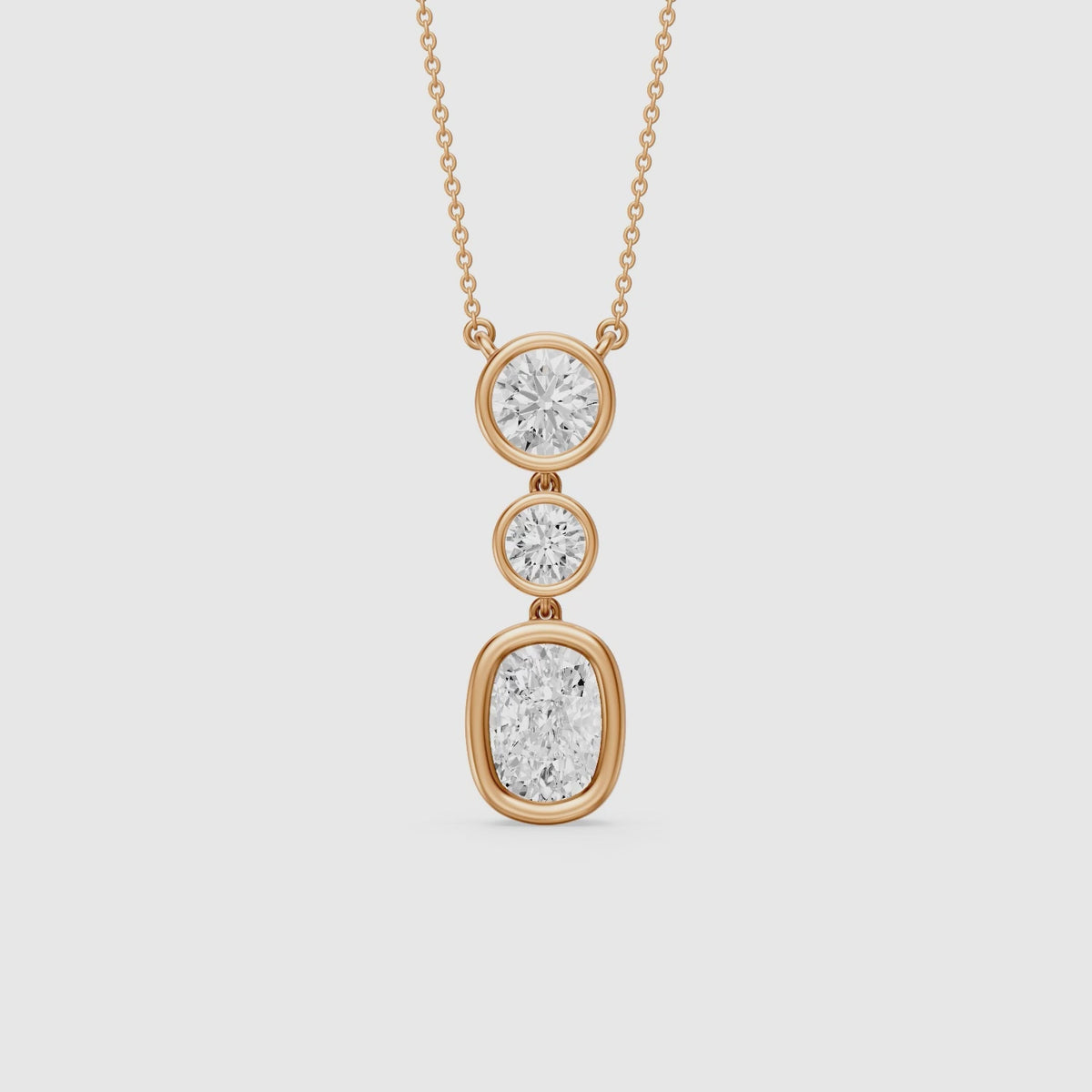 Load video: Demi Elongated Cushion and Round Bezel Lab Grown Diamond Drop Pendant
