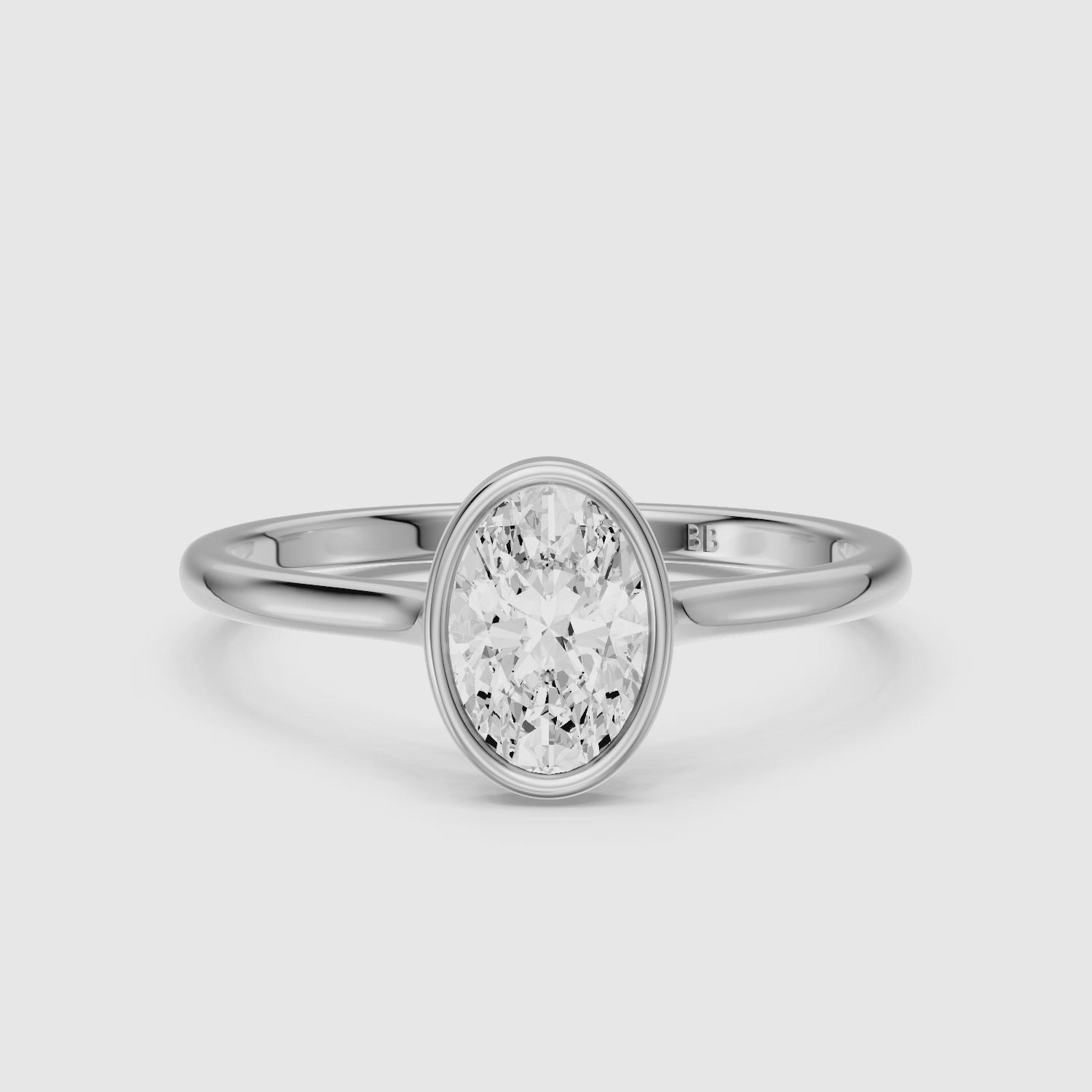 Load video: Nina Oval Cut Bezel Set Solitaire Lab Grown Diamond Ring