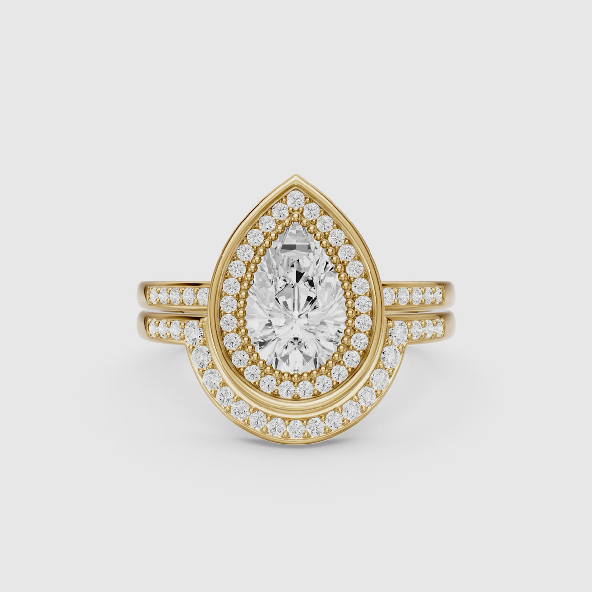 Load video: Cameron Pear Shaped Lab Grown Diamond Halo Bridal Set with Contour Band