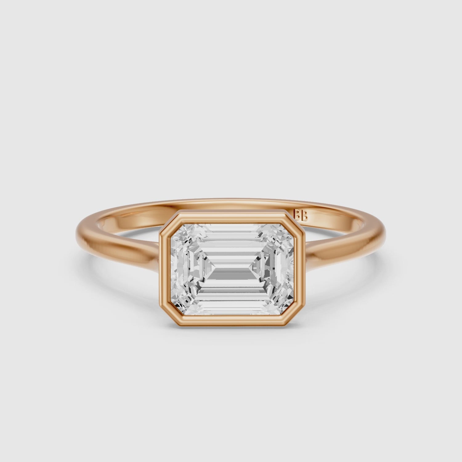 Load video: Abigail Emerald Cut East West Bezel Set Solitaire Moissanite Diamond Ring