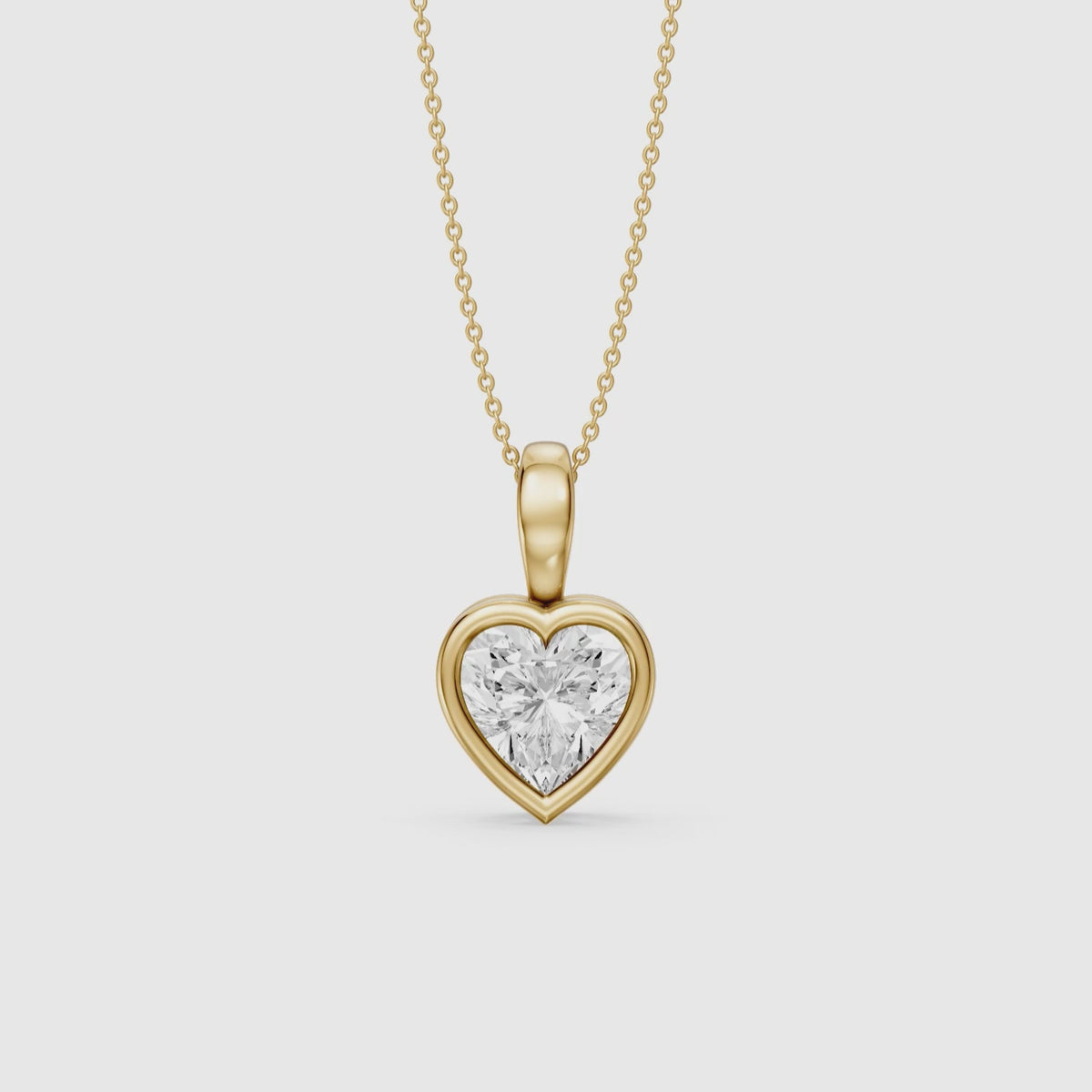 Load video: Anne Heart Shape Bezel Set Lab Grown Diamond Solitaire Pendant