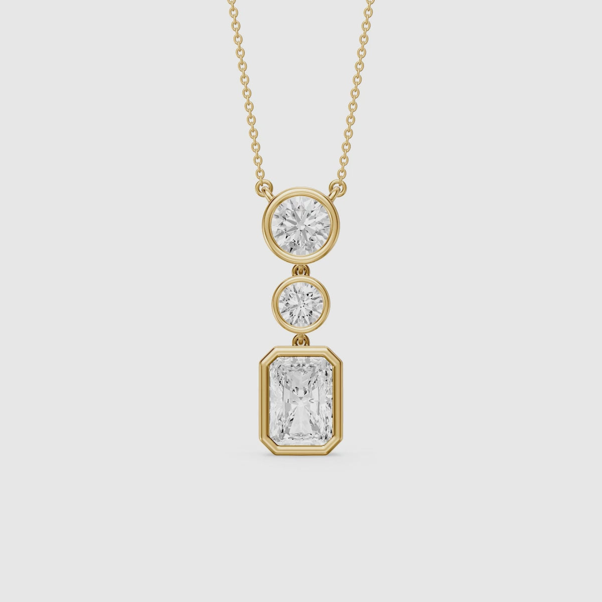 Load video: Laura Radiant Cut and Round Lab Grown Diamond Bezel Drop Pendant